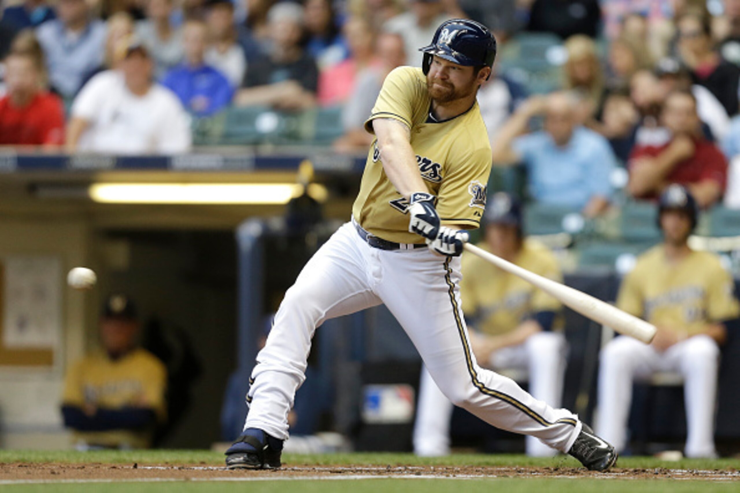 MILWAUKEE, WI - AUGUST 05: Adam Lind #24 of the Milwaukee Brewers hits a single in the first inning against the San Diego Padres at Miller Park on August 05, 2015 in Milwaukee, Wisconsin. (Photo by Mike McGinnis/Getty Images)