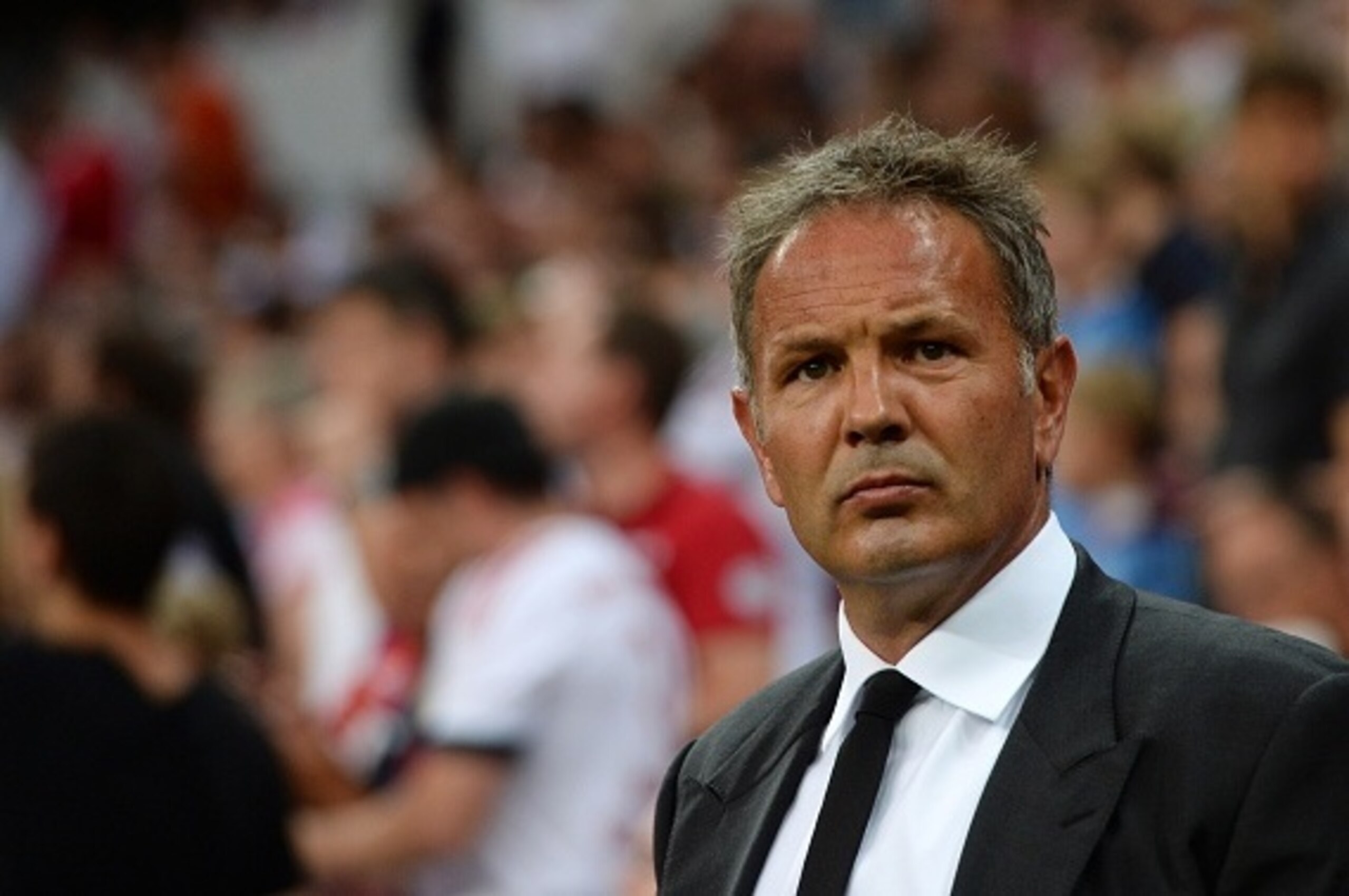 Milan's Serbian headcoach Sinisa Mihajlovic waits ahead  of the Audi Cup football match FC Bayern Munich vs AC Milan in Munich, southern Germany, on August 4, 2015. The Audi Cup football matches with Bayern Munich of Germany, Real Madrid of Spain, AC Mila
