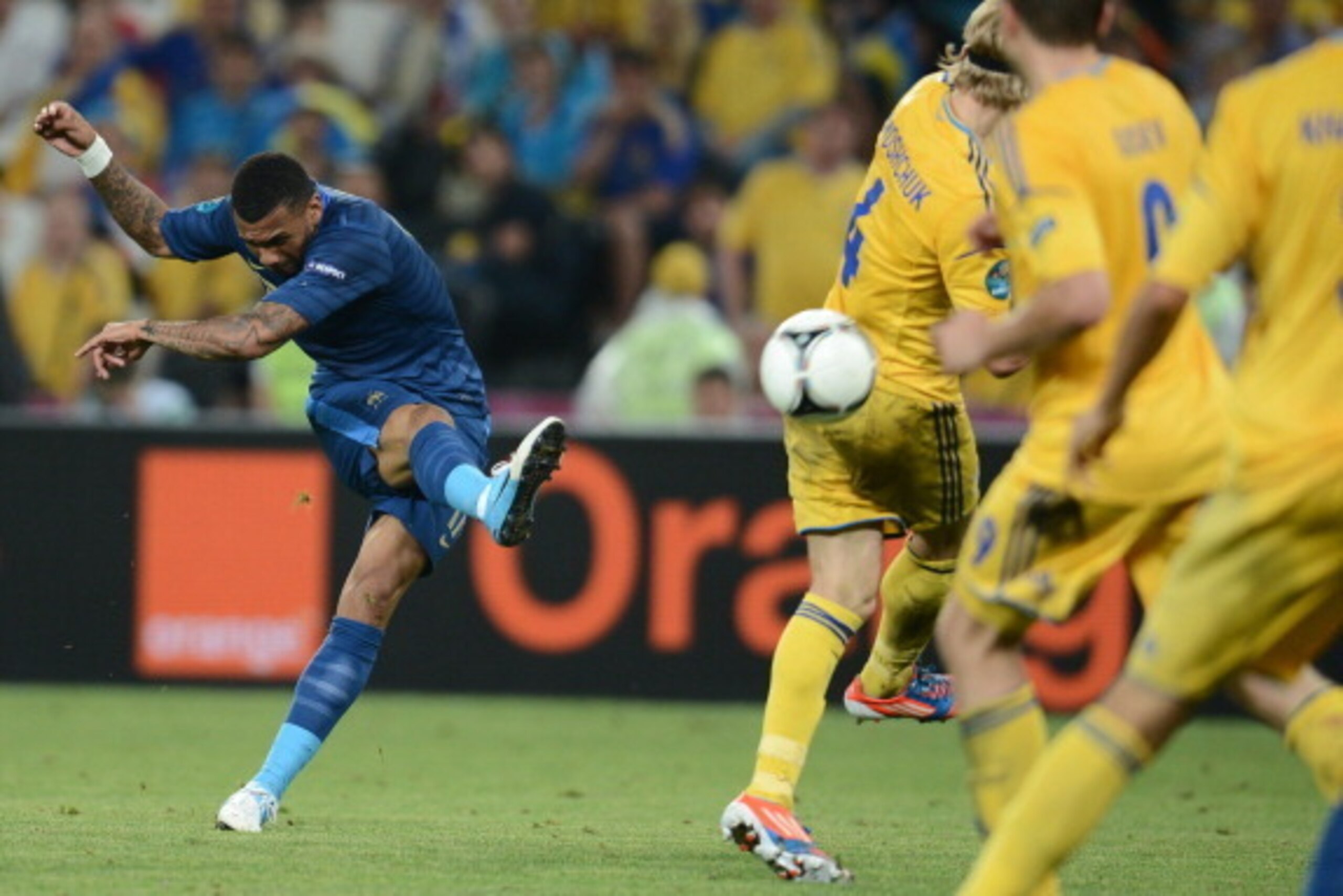 French midfielder Yann M'Vila (L) has a shot on goal during the Euro 2012 championships football match Ukraine vs France on June 15, 2012 at the Donbass Arena in Donetsk.   AFP PHOTO / FRANCK FIFE        (Photo credit should read FRANCK FIFE/AFP/GettyImag