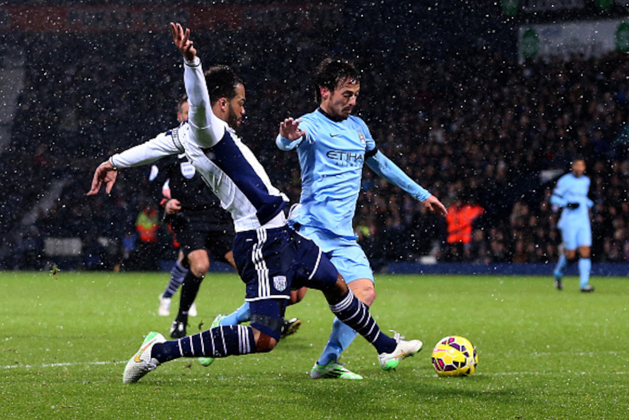 WEST BROMWICH, ENGLAND - DECEMBER 26:  Joleon Lescott of West Brom fouls David Silva of Manchester City and concedes a penalty during the Barclays Premier League match between West Bromwich Albion and Manchester City at The Hawthorns on December 26, 2014 