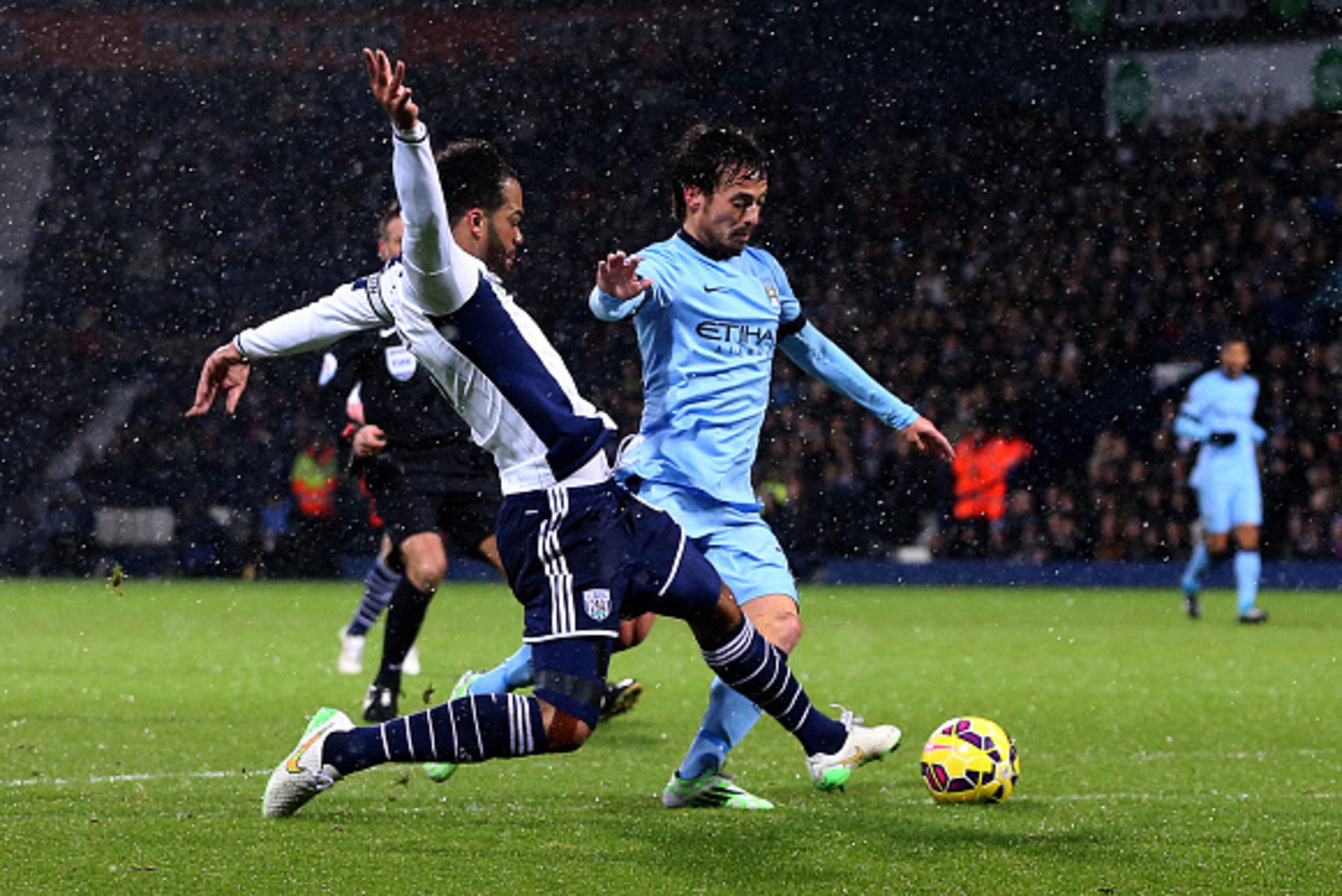 WEST BROMWICH, ENGLAND - DECEMBER 26:  Joleon Lescott of West Brom fouls David Silva of Manchester City and concedes a penalty during the Barclays Premier League match between West Bromwich Albion and Manchester City at The Hawthorns on December 26, 2014 