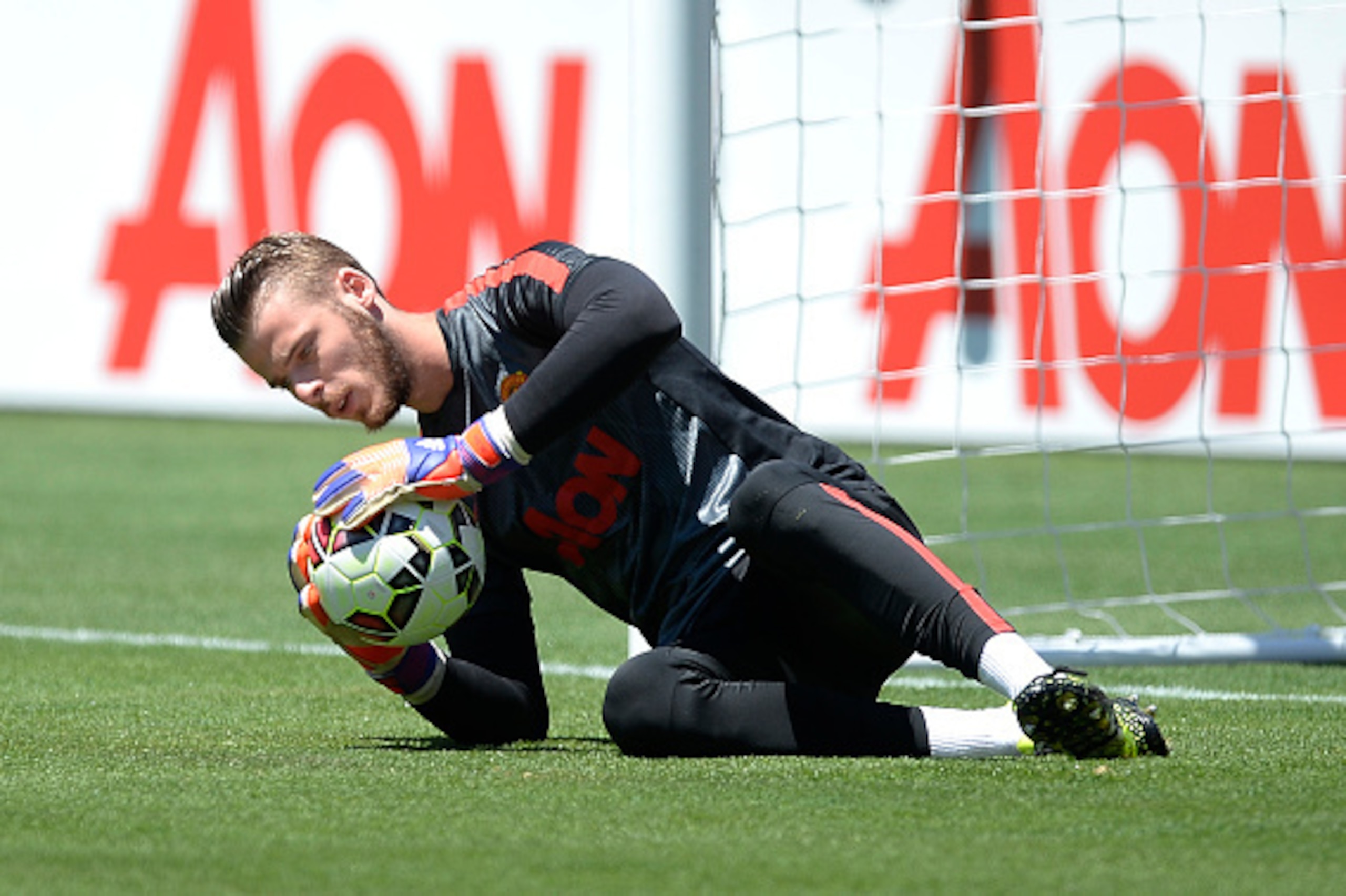 SANTA CLARA, CA - JULY 25:  Goalkeeper David De Gea #1 of Manchester United dives for the ball during warm up before the start of International Champions Cup friendly soccer match against FC Barcelona at the Levi's Stadium July 25, 2015 in Santa Clara, Ca