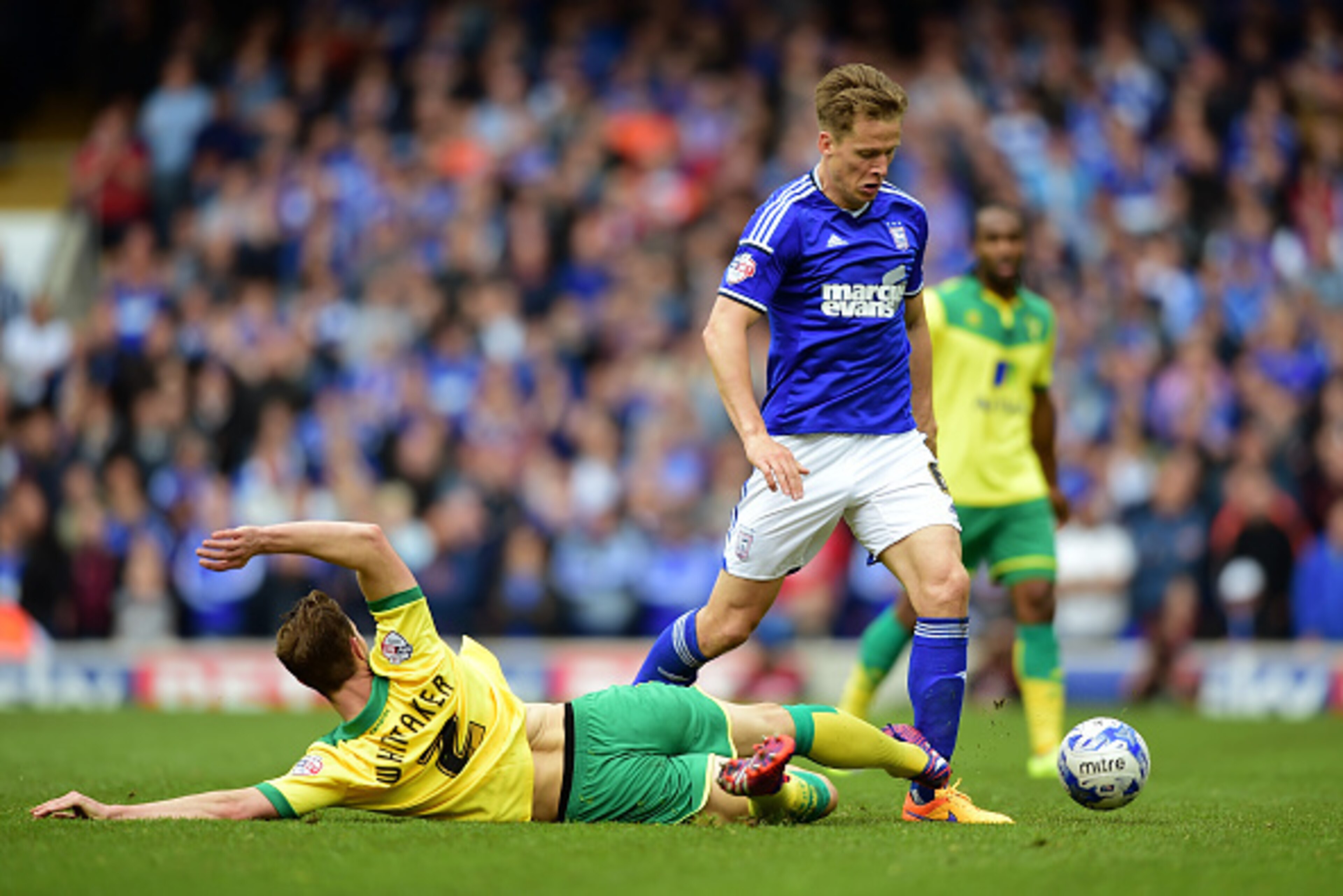IPSWICH, ENGLAND - MAY 09: Christophe Berra of Ipswich is tackled by Steven Whittaker of Norwich during the Sky Bet Championship Playoff semi-final first leg match between Ipswich Town and Norwich Cityat Portman Road on May 9, 2015 in Ipswich, England. ( IPSWICH, ENGLAND - MAY 09: Christophe Berra of Ipswich is tackled by Steven Whittaker of Norwich during the Sky Bet Championship Playoff semi-final first leg match between Ipswich Town and Norwich Cityat Portman Road on May 9, 2015 in Ipswich, England. (