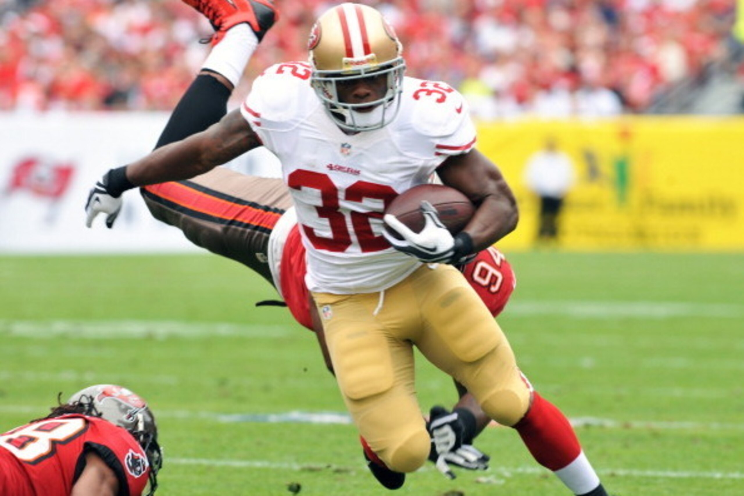TAMPA, FL -  DECEMBER 15:  Running back Kendall Hunter #32 of the San Francisco 49ers runs upfield against the Tampa Bay Buccaneers December 15, 2013 at Raymond James Stadium in Tampa, Florida. The 49ers won 33 - 14.  (Photo by Al Messerschmidt/Getty Imag