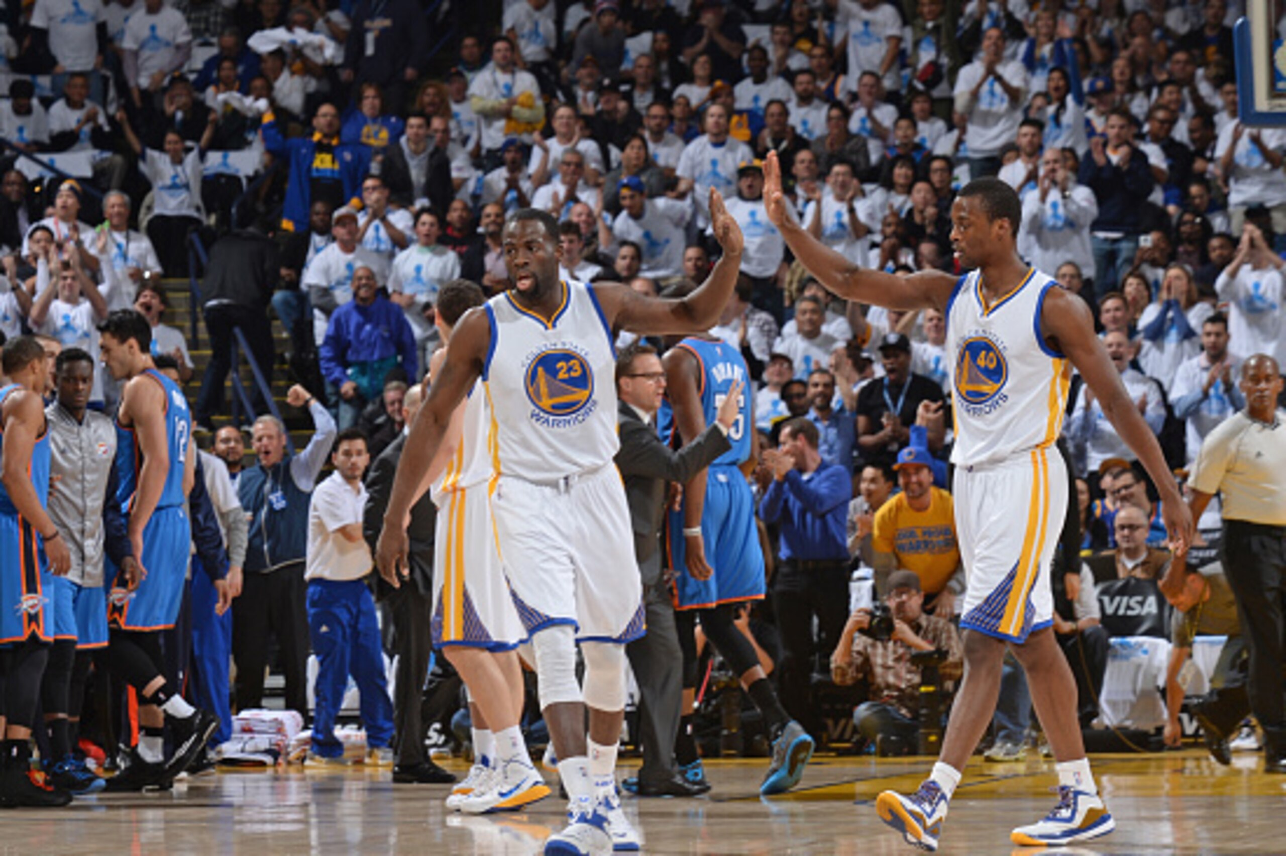 OAKLAND, CA - JANUARY 5:  Draymond Green #23 and Harrison Barnes #40 of the Golden State Warriors celebrate during the game against the Oklahoma City Thunder on January 5, 2015 at Oracle Arena in Oakland, California. NOTE TO USER: User expressly acknowled