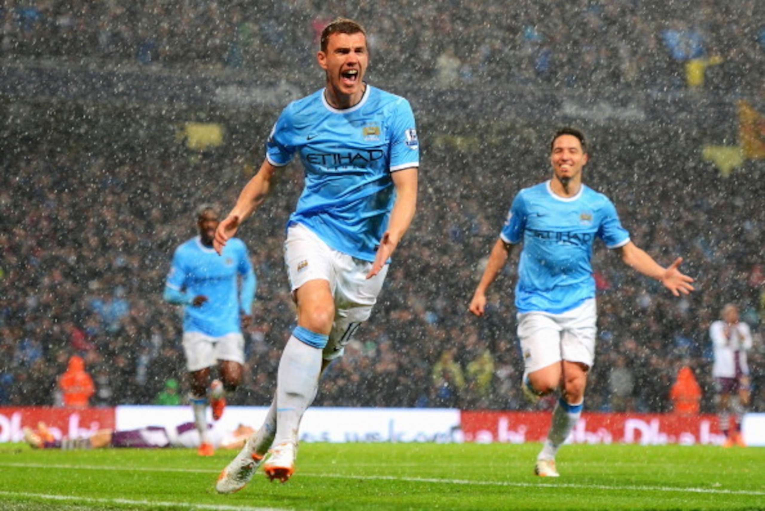 MANCHESTER, ENGLAND - MAY 07:  Edin Dzeko of Manchester City celebrates scoring the opening goal during the Barclays Premier League match between Manchester City and Aston Villa at Etihad Stadium on May 7, 2014 in Manchester, England.  (Photo by Michael R