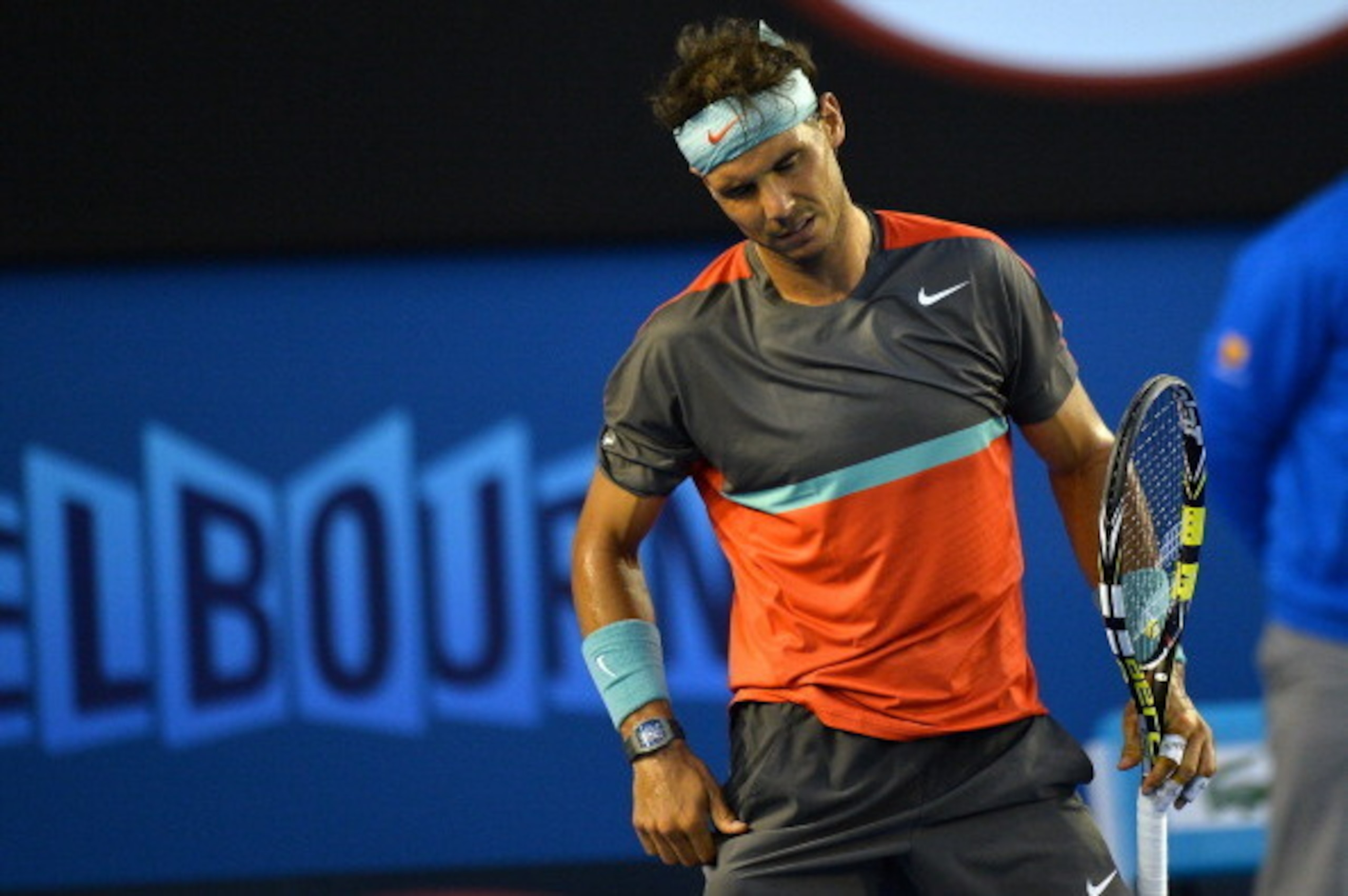 Spain's Rafael Nadal reacts after a point against Switzerland's Stanislas Wawrinka during the men's singles final on day 14 of the 2014 Australian Open tennis tournament in Melbourne on January 26, 2014. AFP PHOTO / SAEED KHAN -- IMAGE RESTRICTED TO EDITO