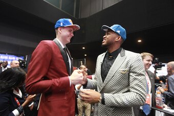 BROOKLYN, NY - JUNE 25:  Kristaps Porzingis, the fourth pick overall in the NBA Draft by the New York Knicks, and Karl-Anthony Towns, the first pick overall in the NBA Draft by the Minnesota Tomberwolves, congratulate each other during the 2015 NBA Draft 
