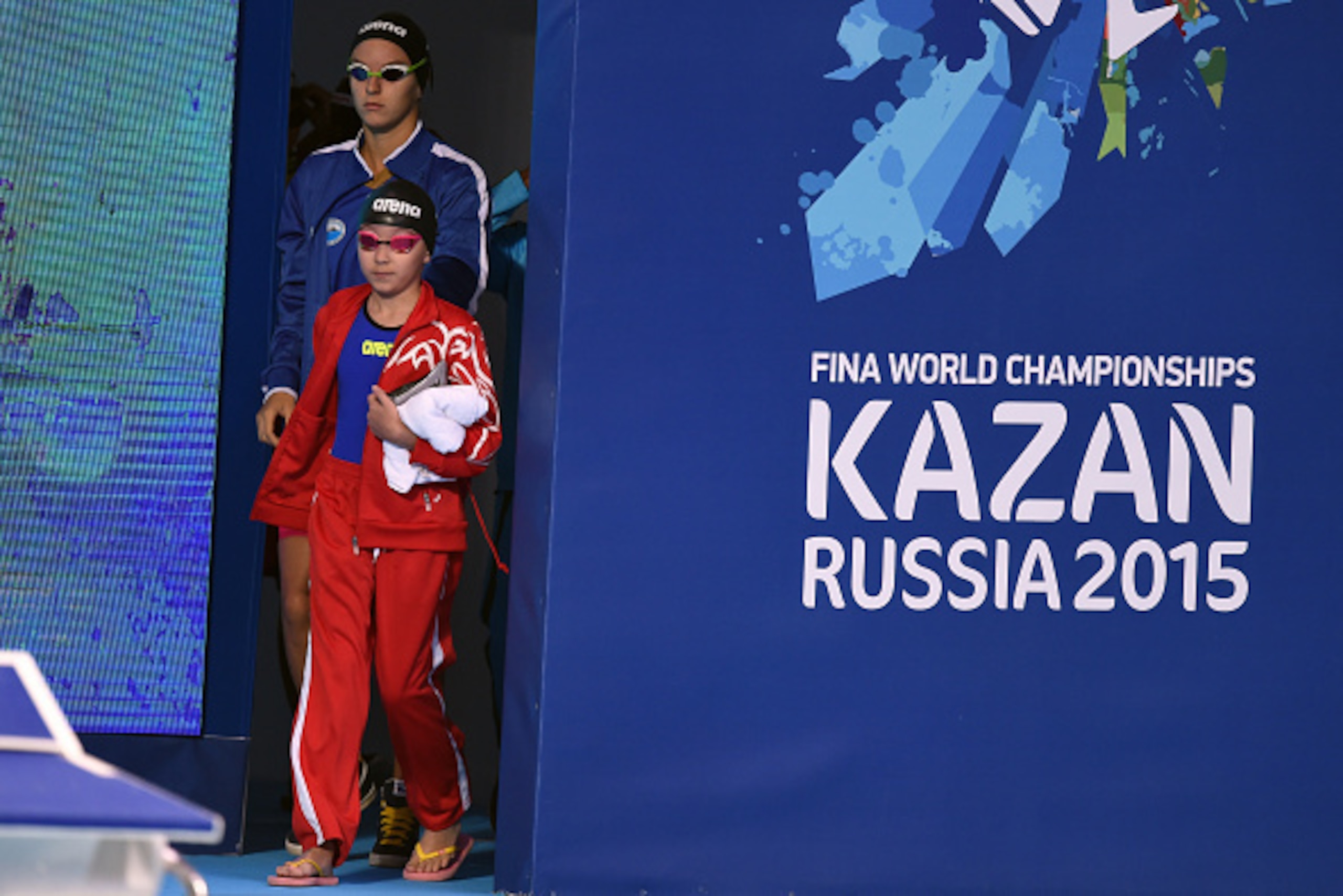 KAZAN, RUSSIA - AUGUST 07:  Alzain Tareq of Bahrain walks out to her starting block to compete in the Women's 50m Butterfly heats on day fourteen of the 16th FINA World Championships at the Kazan Arena on August 7, 2015 in Kazan, Russia.  (Photo by Matthi