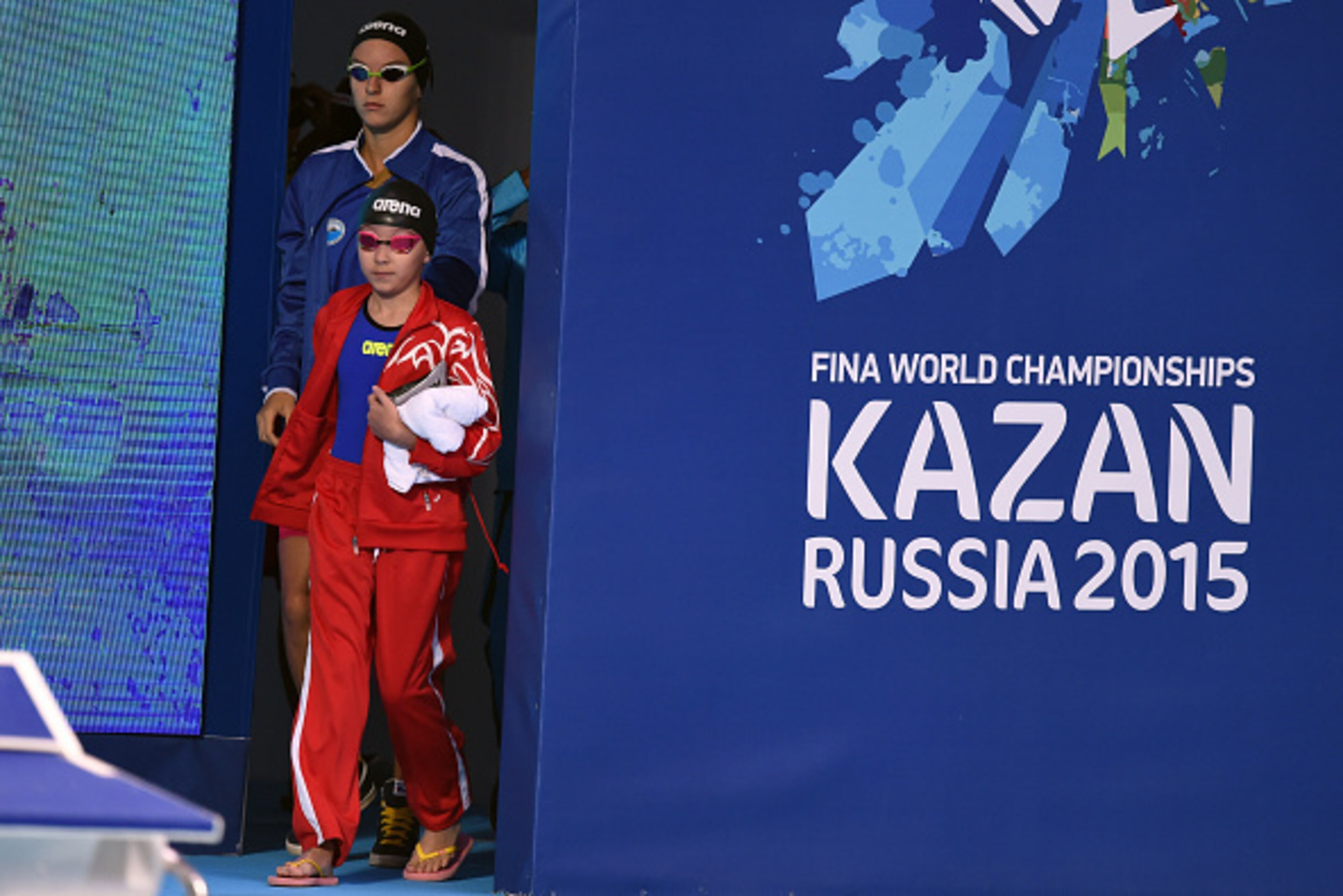 KAZAN, RUSSIA - AUGUST 07:  Alzain Tareq of Bahrain walks out to her starting block to compete in the Women's 50m Butterfly heats on day fourteen of the 16th FINA World Championships at the Kazan Arena on August 7, 2015 in Kazan, Russia.  (Photo by Matthi