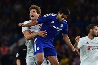 Fiorentina's Spanish defender Marcos Alonso (L) contests a header with Chelsea's Colombian striker Radamel Falcao (2L) during the pre-season friendly International Champions Cup football match between Chelsea and Fiorentina at Stamford Bridge in London on