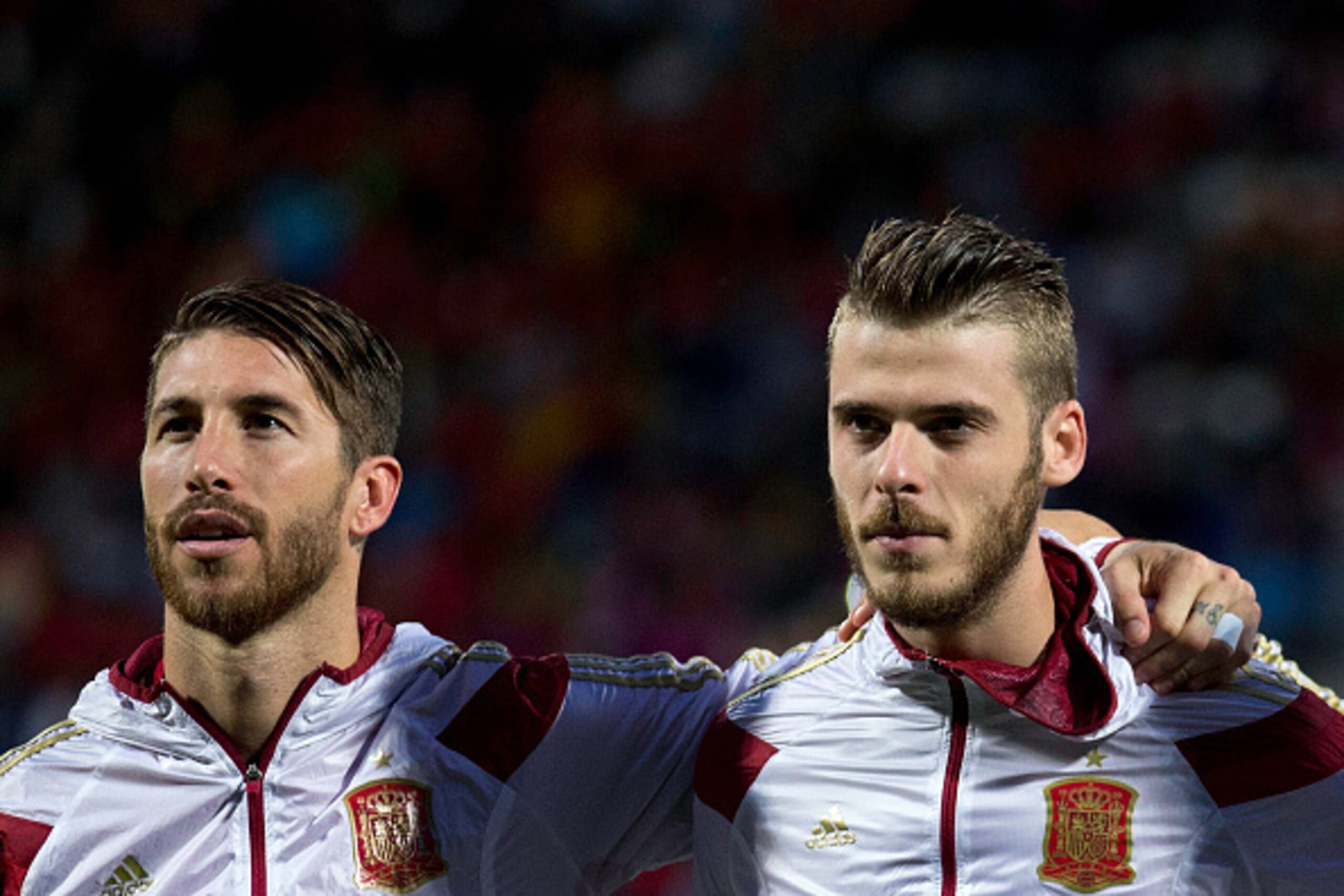 LEON, SPAIN - JUNE 11: Goalkeeper David de Gea (R) of Spain listen to the Spanish national anthem embraced to his teammate Sergio Ramos (R) during the international friendly match between Spain and Costa Rica at Reino de Leon Stadium on June 11, 2015 in L