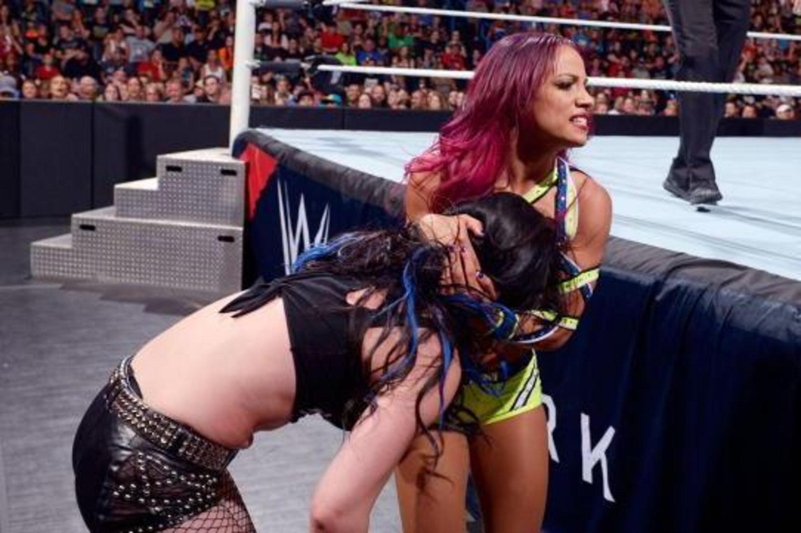 Sasha Banks tangles with Paige.
