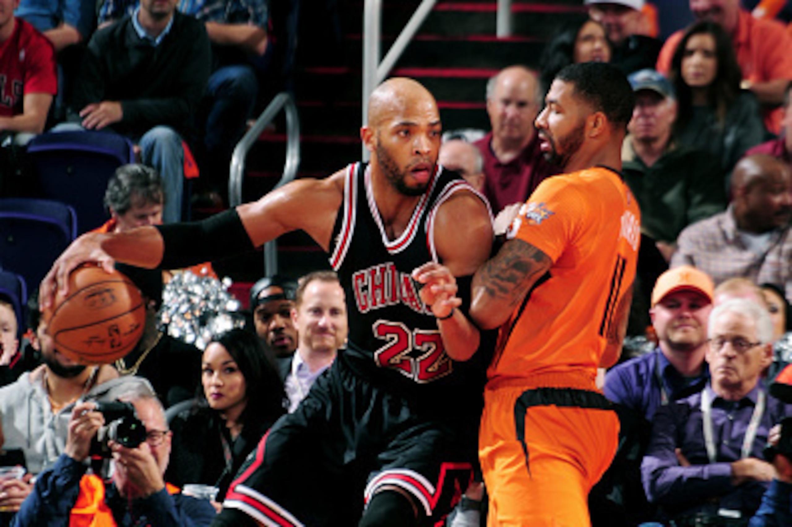 PHOENIX, AZ - JANUARY 30: Taj Gibson #22 of the Chicago Bulls handles the ball against Markieff Morris #11 of the Phoenix Suns on January 30, 2015 at U.S. Airways Center in Phoenix, Arizona. NOTE TO USER: User expressly acknowledges and agrees that, by do PHOENIX, AZ - JANUARY 30: Taj Gibson #22 of the Chicago Bulls handles the ball against Markieff Morris #11 of the Phoenix Suns on January 30, 2015 at U.S. Airways Center in Phoenix, Arizona. NOTE TO USER: User expressly acknowledges and agrees that, by do