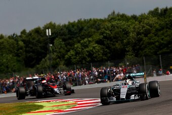 NORTHAMPTON, ENGLAND - JULY 04:  Lewis Hamilton of Great Britain and Mercedes GP drives ahead of Jenson Button of Great Britain and McLaren Honda during final practice for the Formula One Grand Prix of Great Britain at Silverstone Circuit on July 4, 2015 