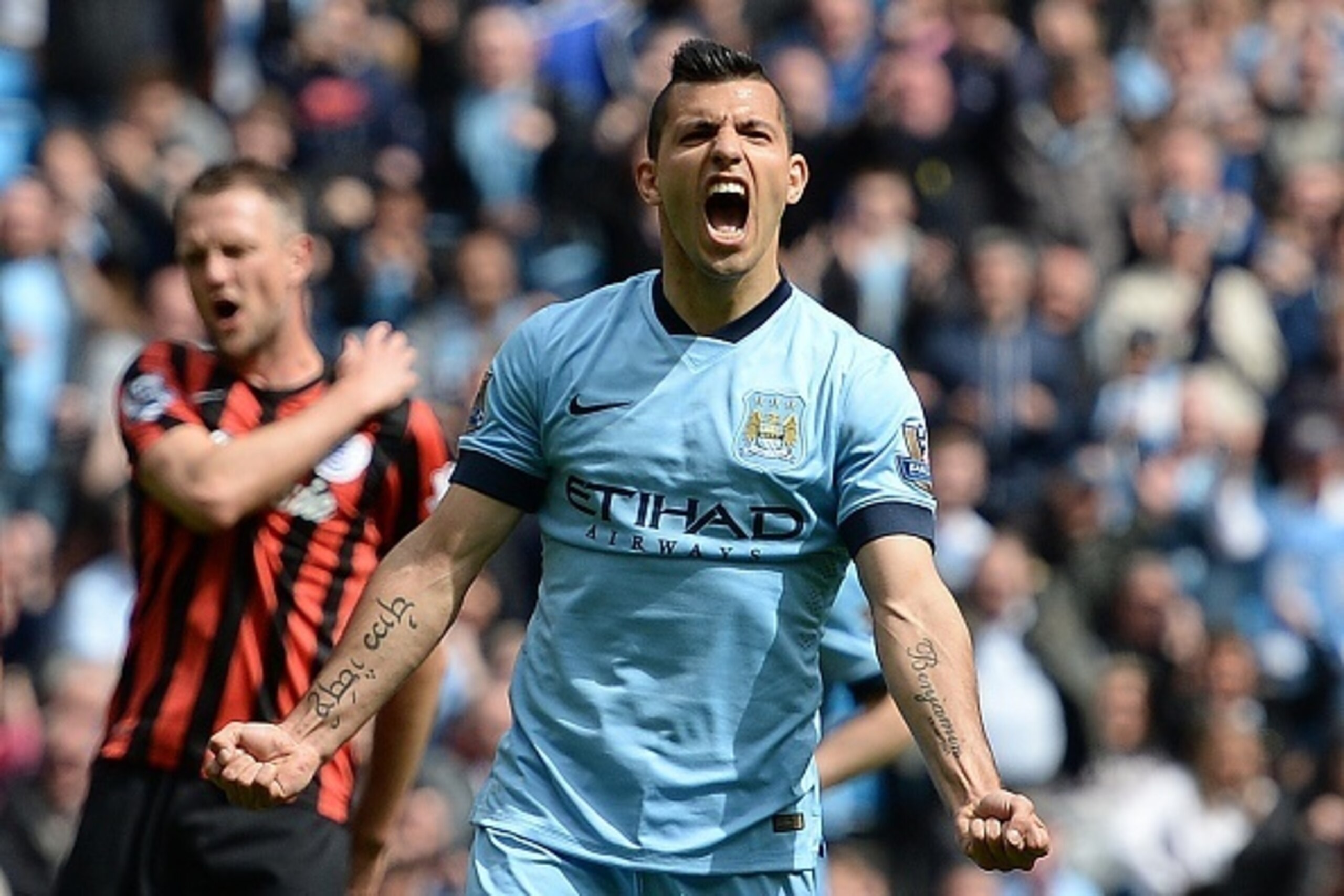 Manchester City's Argentinian striker Sergio Aguero celebrates his third goal during the English Premier League football match between Manchester City and Queens Park Rangers at the Etihad Stadium in Manchester, northwest England, on May 10, 2015.  AFP PH