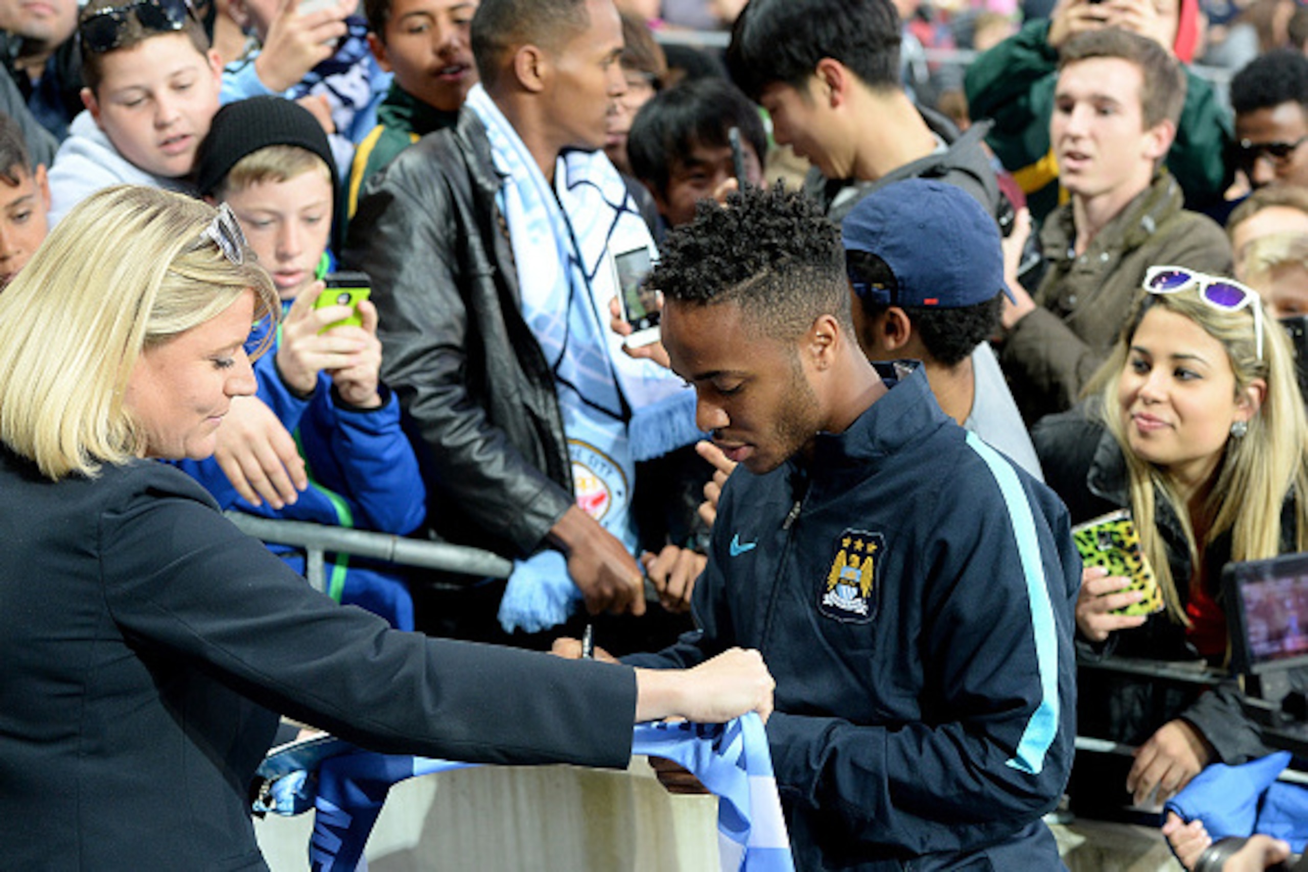 GOLD COAST, AUSTRALIA - JULY 18:  Raheem Sterling greets fans before the international friendly match between Melbourne City and Manchester City at Cbus Super Stadium on July 18, 2015 in Gold Coast, Australia.  (Photo by Bradley Kanaris/Getty Images)