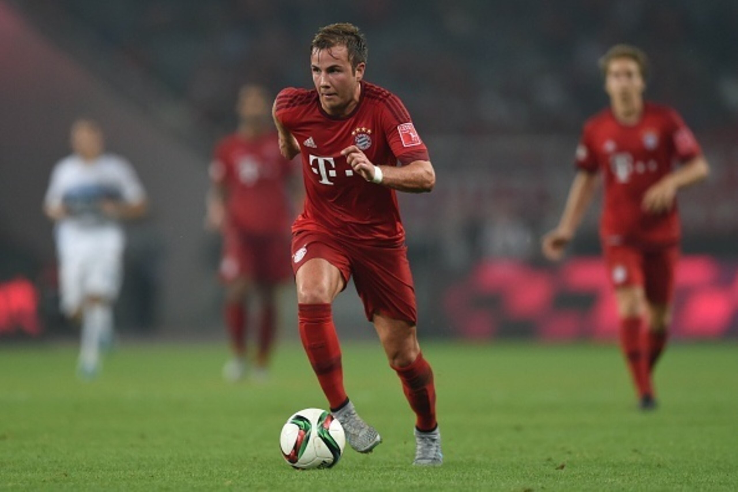 Bayern Munich's midfielder Mario Goetze vies for the ball during a friendly football match between Bayern Munich and Inter Milan in Shanghai on July 21, 2015.  AFP PHOTO / JOHANNES EISELE        (Photo credit should read JOHANNES EISELE/AFP/Getty Images)