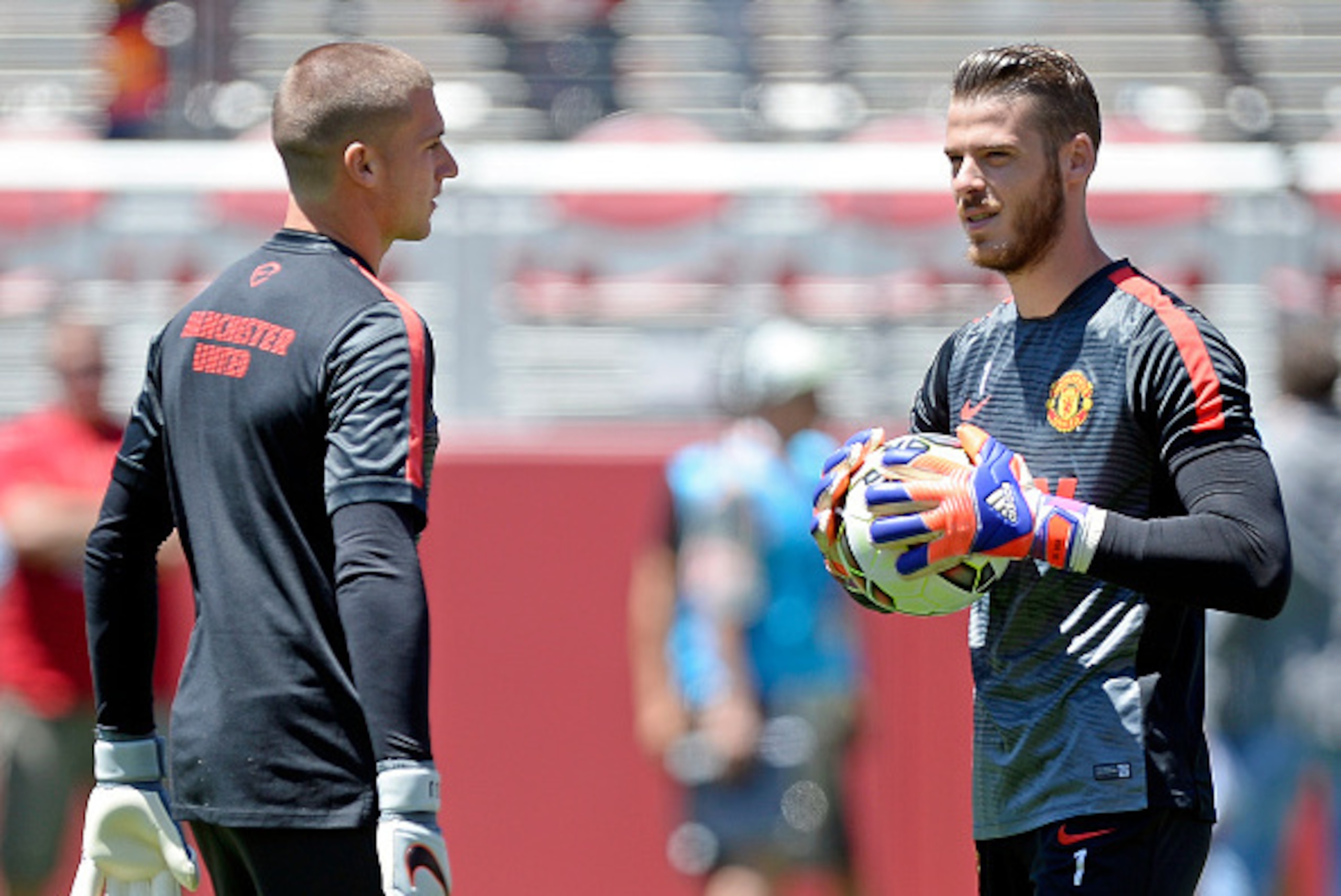 SANTA CLARA, CA - JULY 25:  Goalkeepers David De Gea #1 of Manchester United holding the soccer ball talks with Sam Johnstone #50 during warm up before the start of International Champions Cup friendly soccer match against FC Barcelona at the Levi's Stadi