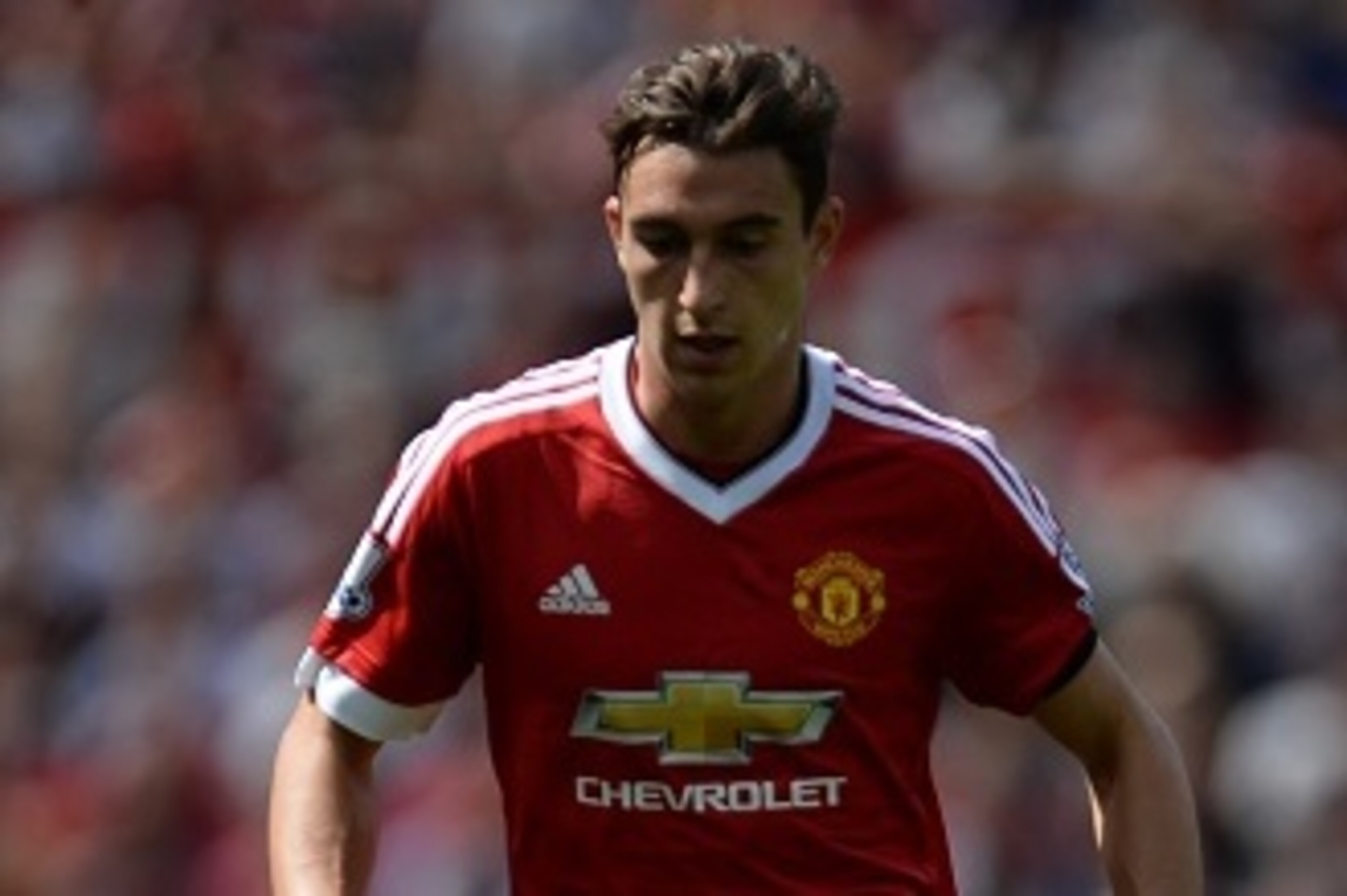 Manchester United's Italian defender Matteo Darmian runs with the ball during the English Premier League football match between Manchester United and Tottenham Hotspur at Old Trafford in Manchester, north west England, on August 8, 2015. AFP PHOTO / OLI S