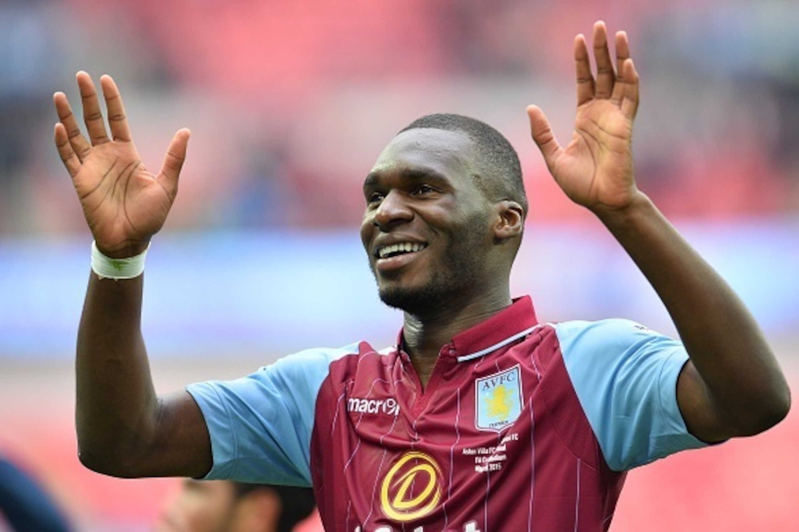 Aston Villa's Zaire-born Belgian striker Christian Benteke waves to supporters after winning the FA Cup semi-final between Aston Villa and Liverpool at Wembley stadium in London on April 19, 2015.
AFP PHOTO / GLYN KIRK
NOT FOR MARKETING OR ADVERTISING USE