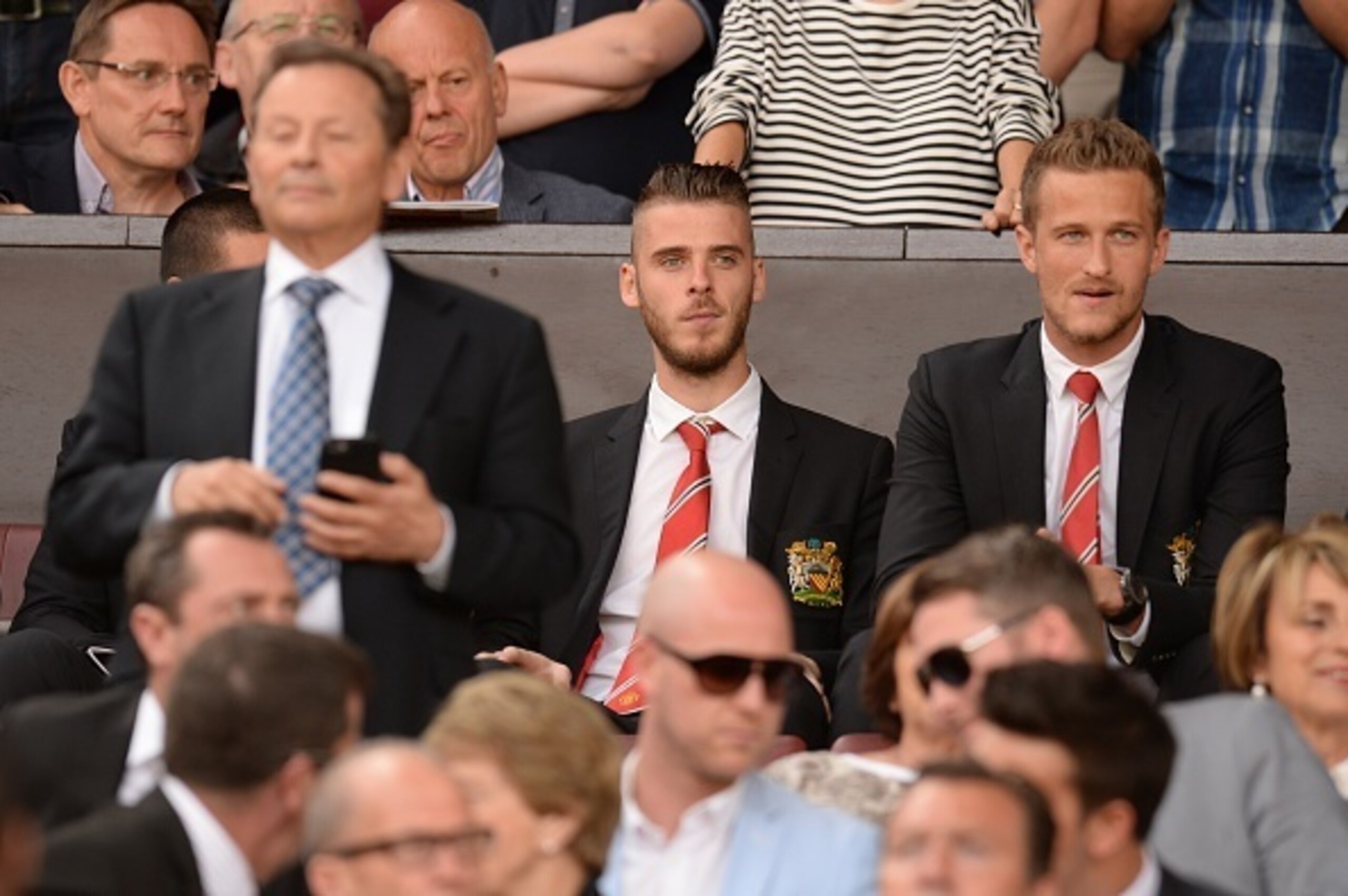 Manchester United's Spanish goalkeeper David de Gea (C) watches from the stands ahead of the English Premier League football match between Manchester United and Tottenham Hotspur at Old Trafford in Manchester, north west England, on August 8, 2015. AFP PH Manchester United's Spanish goalkeeper David de Gea (C) watches from the stands ahead of the English Premier League football match between Manchester United and Tottenham Hotspur at Old Trafford in Manchester, north west England, on August 8, 2015. AFP PH