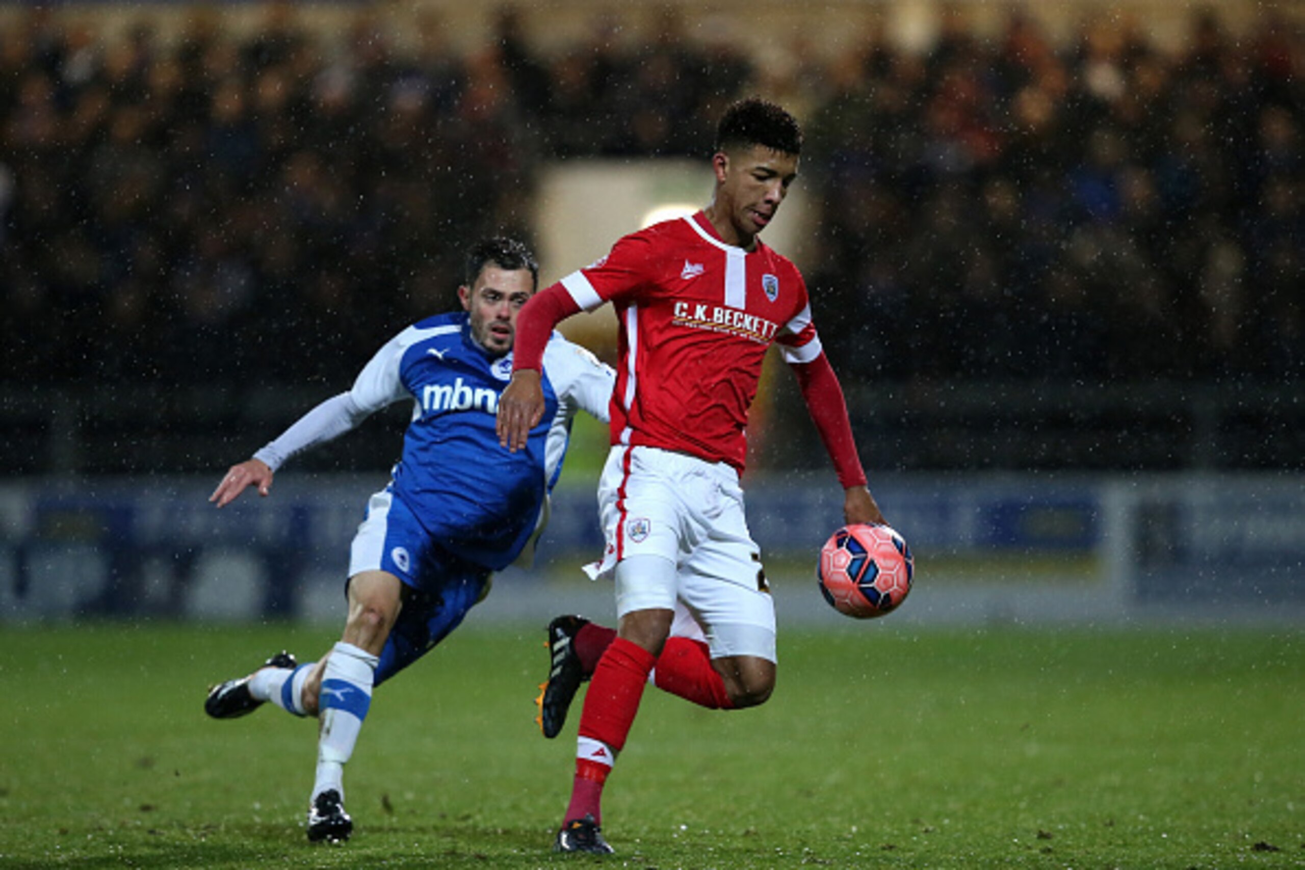 CHESTER, ENGLAND - DECEMBER 16: Mason Holgate of Barnsley clears the ball from Craig Mahon of Chester during the FA Cup Second Round Replay match between Chester City and Barnsley at Deva Stadium on December 16, 2014 in Chester, England. (Photo by Jan K CHESTER, ENGLAND - DECEMBER 16: Mason Holgate of Barnsley clears the ball from Craig Mahon of Chester during the FA Cup Second Round Replay match between Chester City and Barnsley at Deva Stadium on December 16, 2014 in Chester, England. (Photo by Jan K