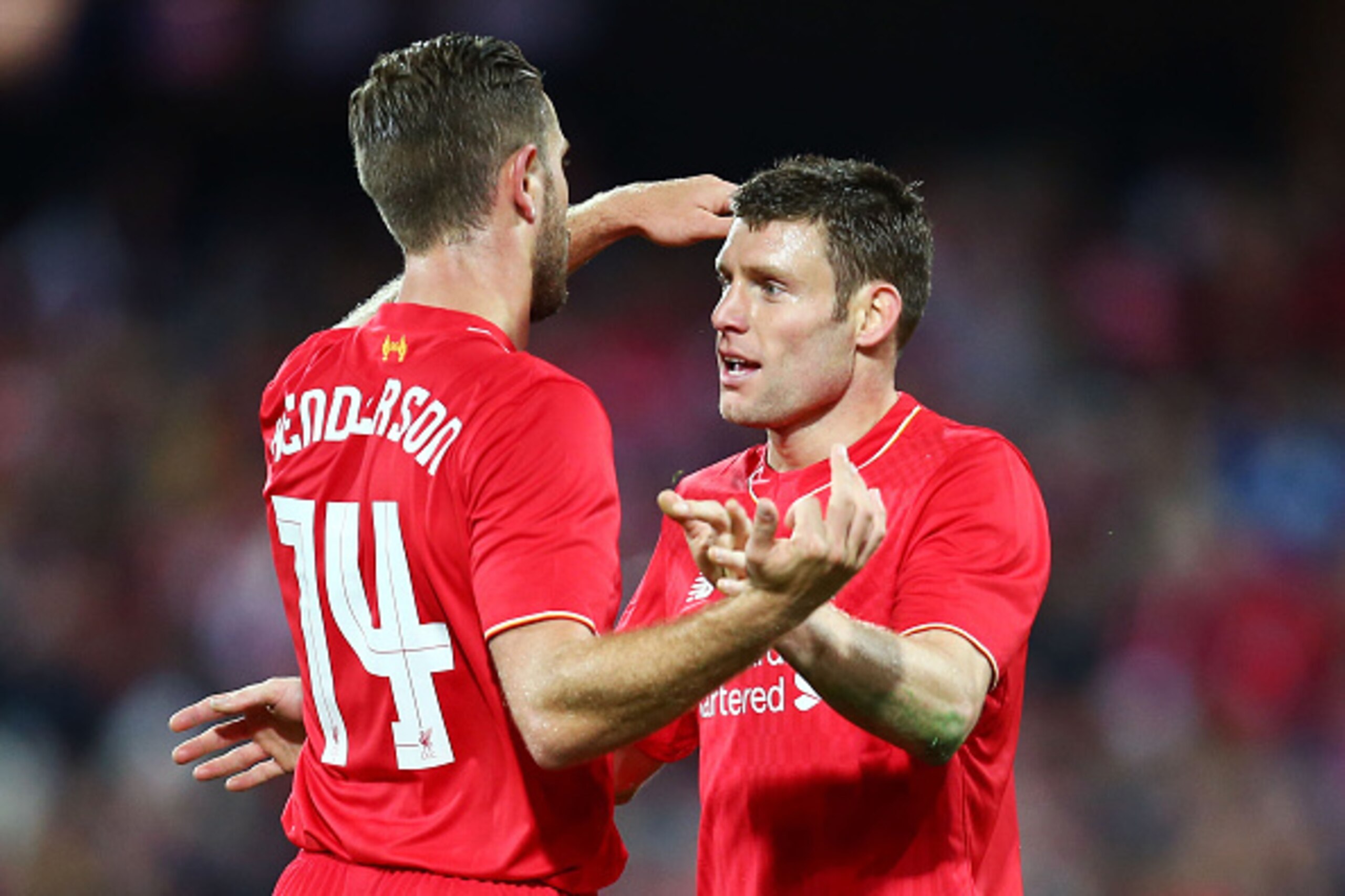 ADELAIDE, AUSTRALIA - JULY 20:  James Milner (R) of Liverpool celebrates with Jordan Henderson (L) after scoring the first goal during the international friendly match between Adelaide United and Liverpool FC at Adelaide Oval on July 20, 2015 in Adelaide,