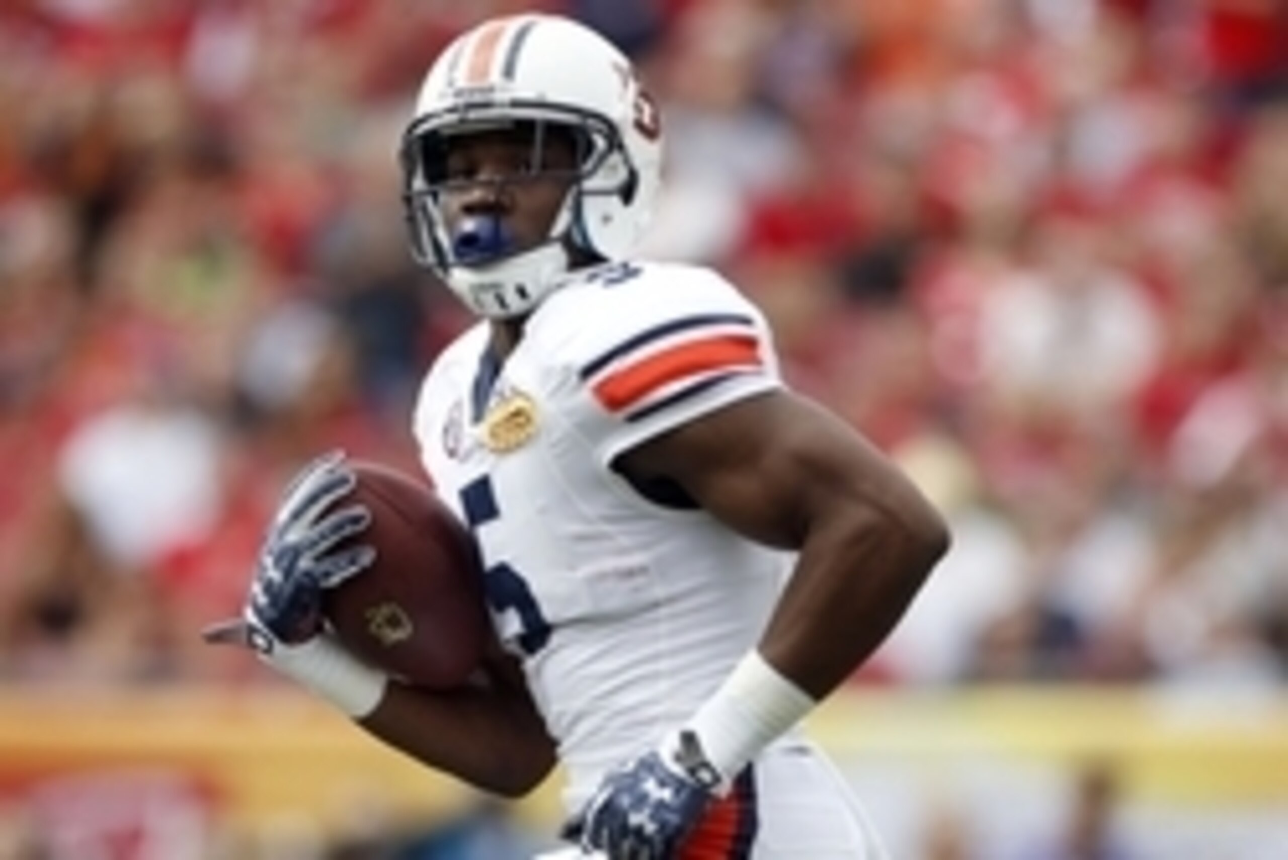 Jan 1, 2015; Tampa, FL, USA; Auburn Tigers wide receiver Ricardo Louis (5) runs the ball for a touchdown against the Wisconsin Badgers during the first half in the 2015 Outback Bowl at Raymond James Stadium. Mandatory Credit: Mark Zerof-USA TODAY Sports