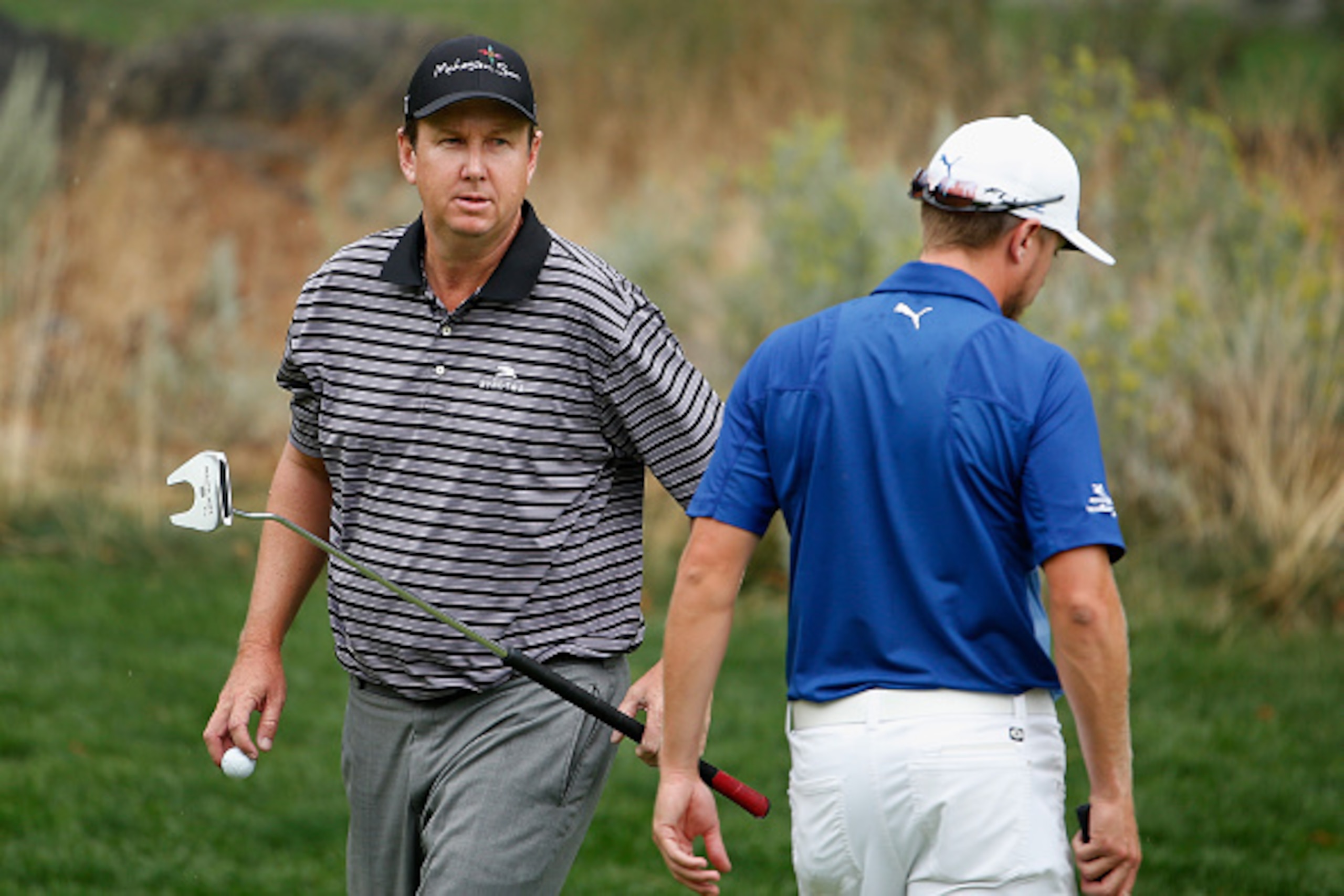 RENO, NV - AUGUST 08:  J.J. Henry (L) walks past Jonas Blixt of Sweden on the third green during the third round of the Barracuda Championship at the Montreux Golf and Country Club on August 8, 2015 in Reno, Nevada.  (Photo by Christian Petersen/Getty Ima