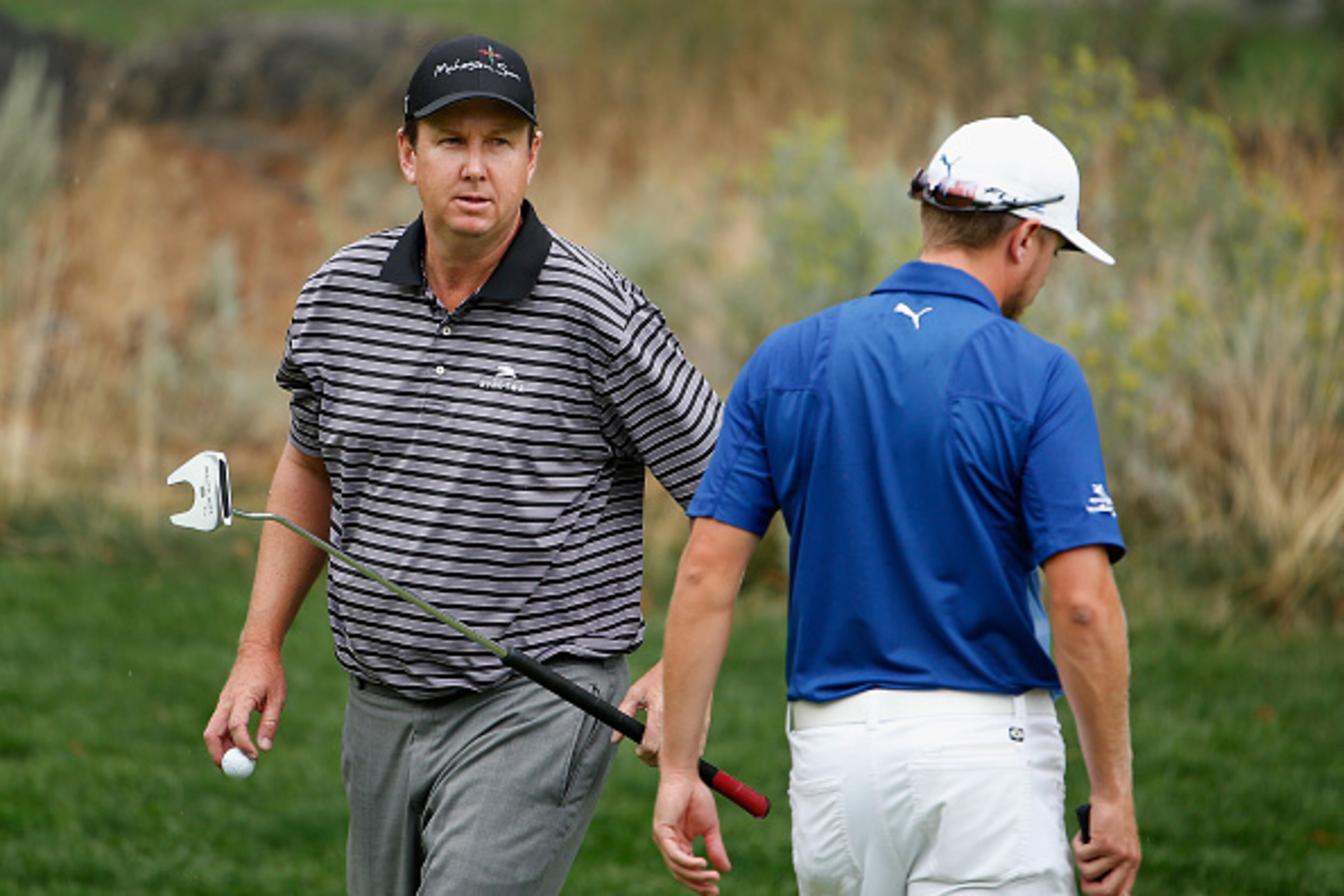RENO, NV - AUGUST 08:  J.J. Henry (L) walks past Jonas Blixt of Sweden on the third green during the third round of the Barracuda Championship at the Montreux Golf and Country Club on August 8, 2015 in Reno, Nevada.  (Photo by Christian Petersen/Getty Ima