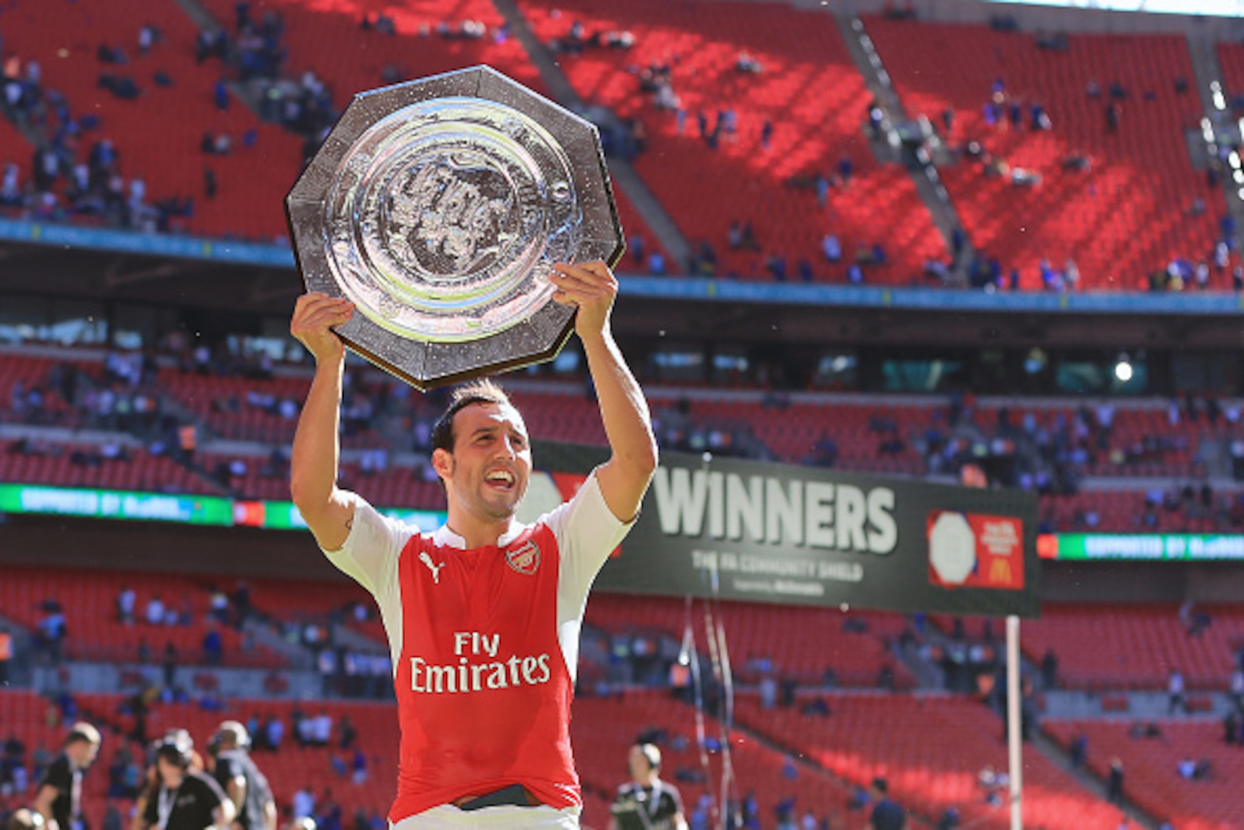 LONDON, ENGLAND -  AUGUST 2:  Santi Cazorla of Arsenal celebrates with the FA Community Shield trophy after the FA Community Shield match between Chelsea and Arsenal at Wembley Stadium on August 2, 2015 in London, England.  (Photo by James Bayliss - AMA/G