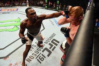 NASHVILLE, TN - AUGUST 08:  (L-R) Derek Brunson punches Sam Alvey in their middleweight bout during the UFC Fight Night event at Bridgestone Arena on August 8, 2015 in Nashville, Tennessee.  (Photo by Josh Hedges/Zuffa LLC/Zuffa LLC via Getty Images)
