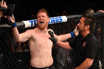 NASHVILLE, TN - AUGUST 08:  (L-R) Sam Alvey contests his loss to referee Mario Yamasaki after losing to Derek Brunson in their middleweight bout during the UFC Fight Night event at Bridgestone Arena on August 8, 2015 in Nashville, Tennessee.  (Photo by Jo