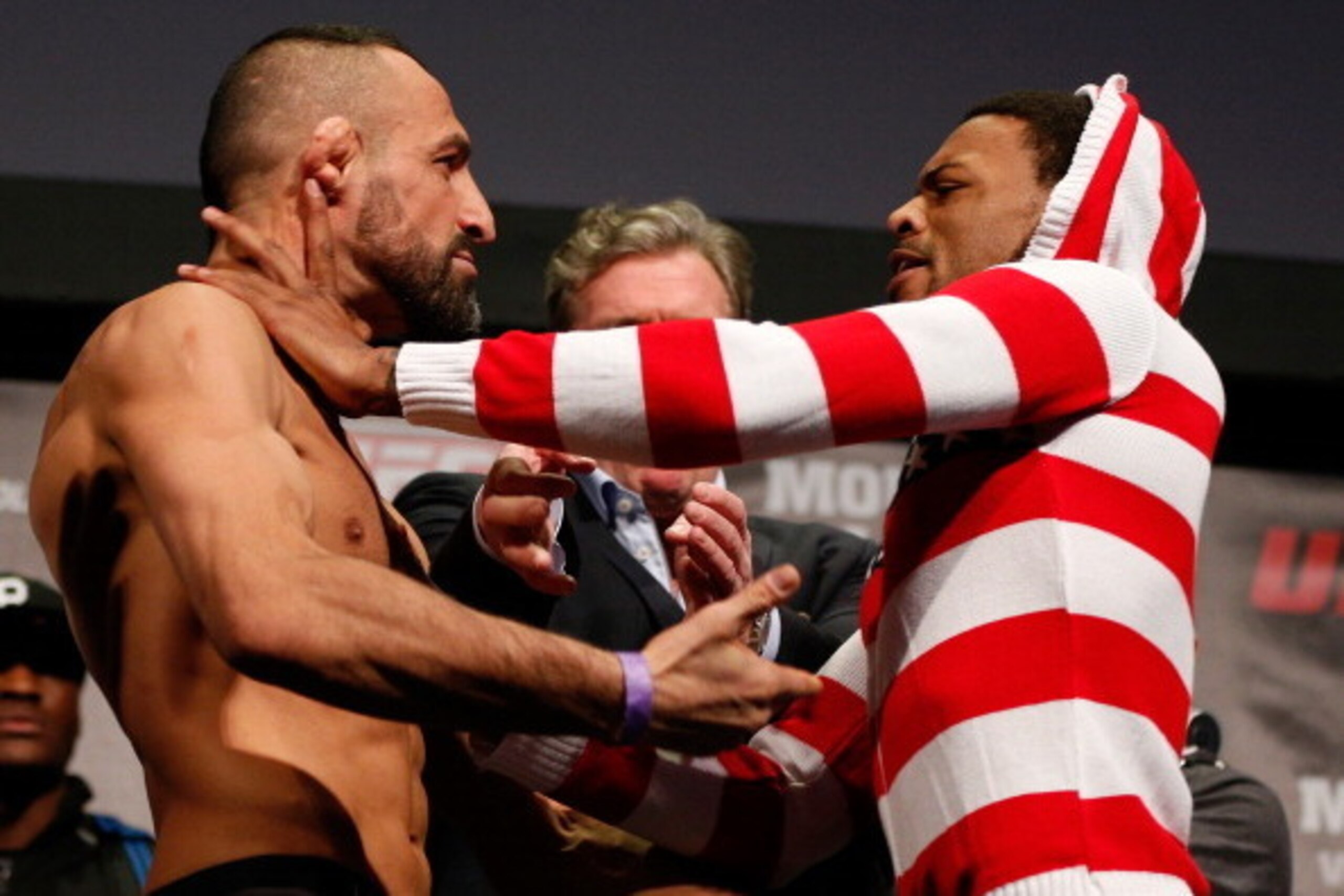 STOCKHOLM, SWEDEN - APRIL 05:  (L-R) Opponents Reza Madadi and Michael Johnson face off during the UFC weigh-in at the Ericsson Globe Arena on April 5, 2013 in Stockholm, Sweden.  (Photo by Josh Hedges/Zuffa LLC/Zuffa LLC via Getty Images)