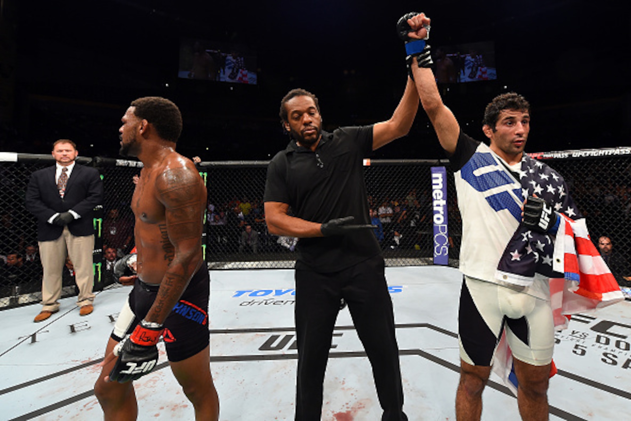 NASHVILLE, TN - AUGUST 08:  (R-L) Beneil Dariush celebrates after defeating Michael Johnson in their lightweight bout during the UFC Fight Night event at Bridgestone Arena on August 8, 2015 in Nashville, Tennessee.  (Photo by Josh Hedges/Zuffa LLC/Zuffa L