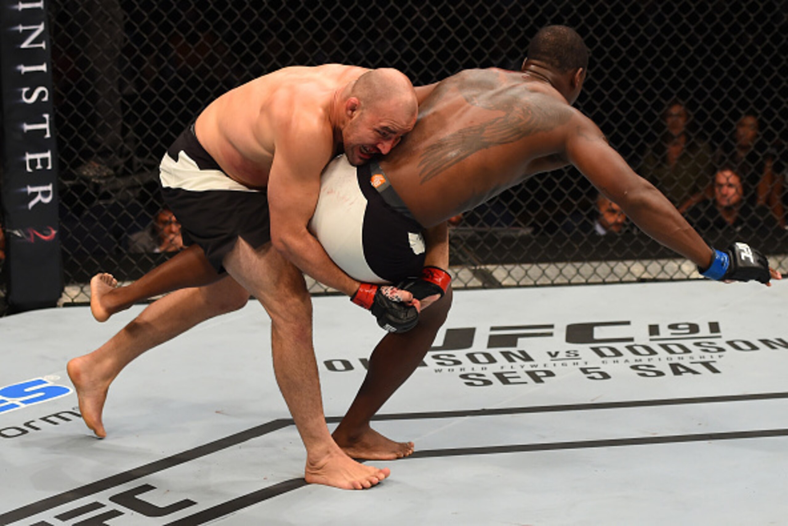 NASHVILLE, TN - AUGUST 08:  (L-R) Glover Teixeira of Brazil takes down Ovince Saint Preux in their light heavyweight bout during the UFC Fight Night event at Bridgestone Arena on August 8, 2015 in Nashville, Tennessee.  (Photo by Josh Hedges/Zuffa LLC/Zuf