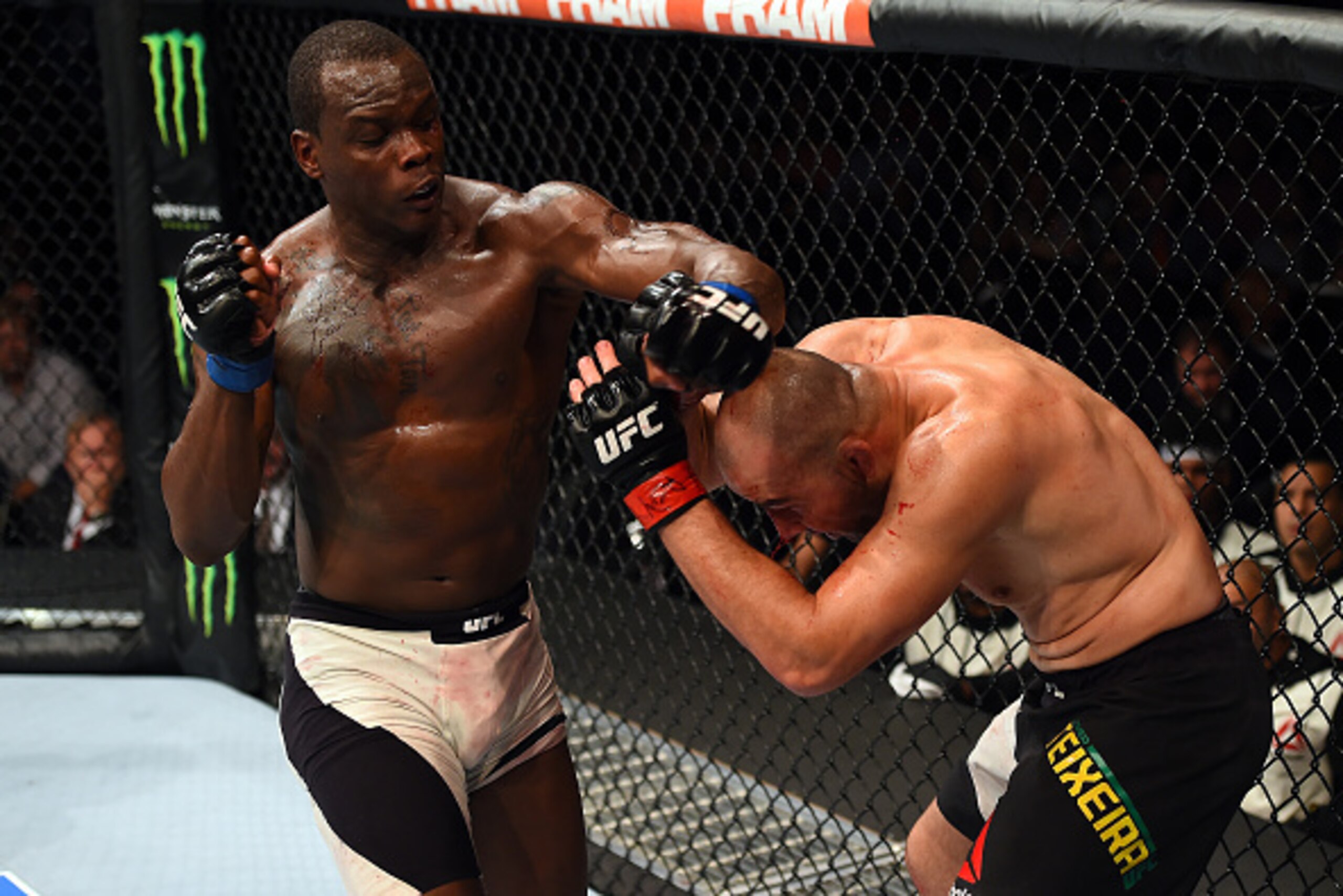 NASHVILLE, TN - AUGUST 08:  (L-R) Ovince Saint Preux punches Glover Teixeira of Brazil in their light heavyweight bout during the UFC Fight Night event at Bridgestone Arena on August 8, 2015 in Nashville, Tennessee.  (Photo by Josh Hedges/Zuffa LLC/Zuffa 