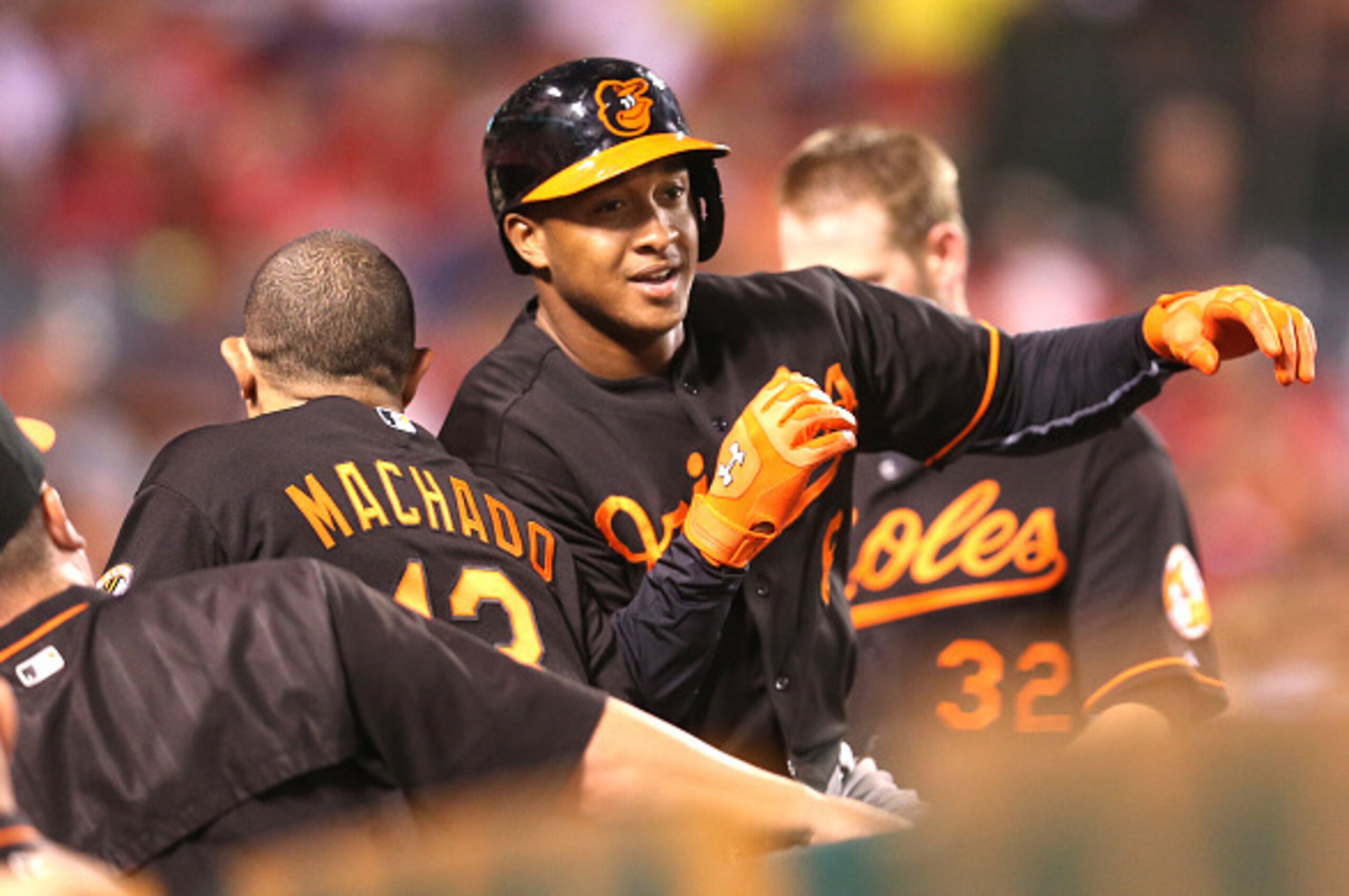 ANAHEIM, CA - AUGUST 07:  Jonathan Schoop #6 of the Baltimore Orioles celebrates with Manny Machada #13 as he returns to the dugout after hitting a two run home run in the fourth inning against the Los Angeles Angels of Anaheim at Angel Stadium of Anaheim