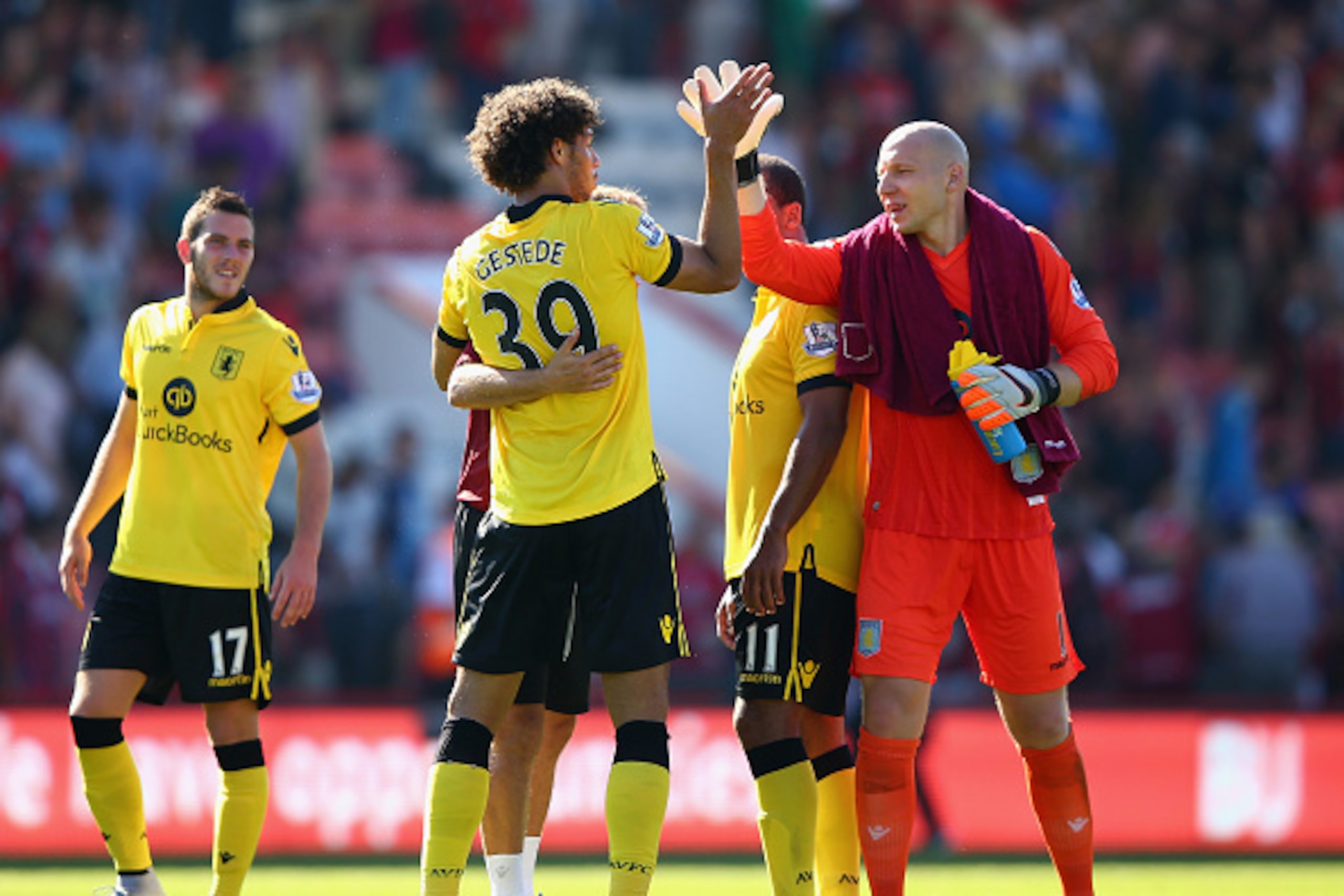 BOURNEMOUTH, ENGLAND - AUGUST 08:  Rudy Gestede (2nd L) of Aston Villa celebrates his team's 1-0 win with his team mate Brad Guzan (R) in the Barclays Premier League match between A.F.C. Bournemouth and Aston Villa at Vitality Stadium on August 8, 2015 in