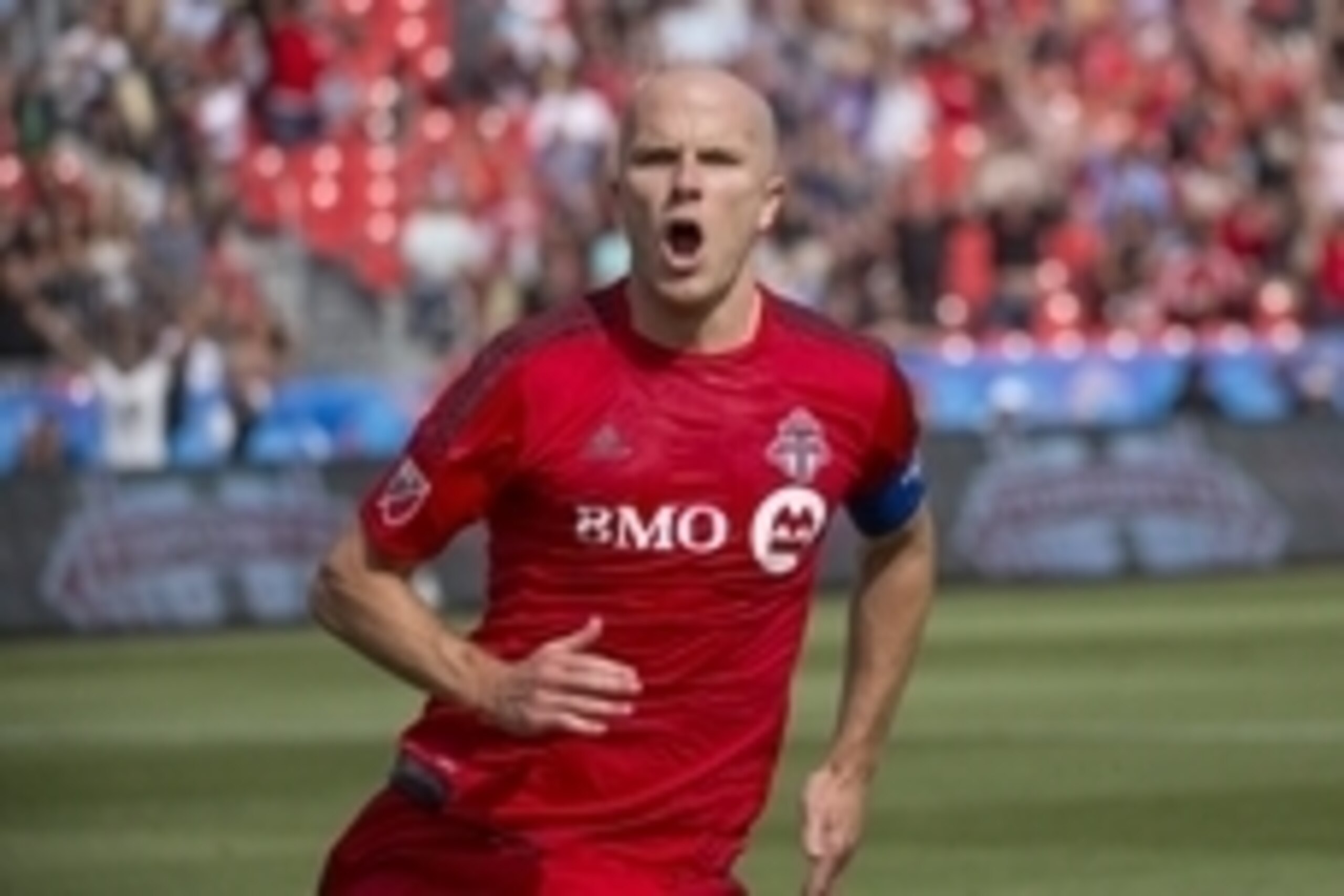 Aug 8, 2015; Toronto, Ontario, CAN; Toronto FC midfielder Michael Bradley (4) celebrates after scoring a goal during the first half in a game against Sporting KC at BMO Field. Mandatory Credit: Nick Turchiaro-USA TODAY Sports