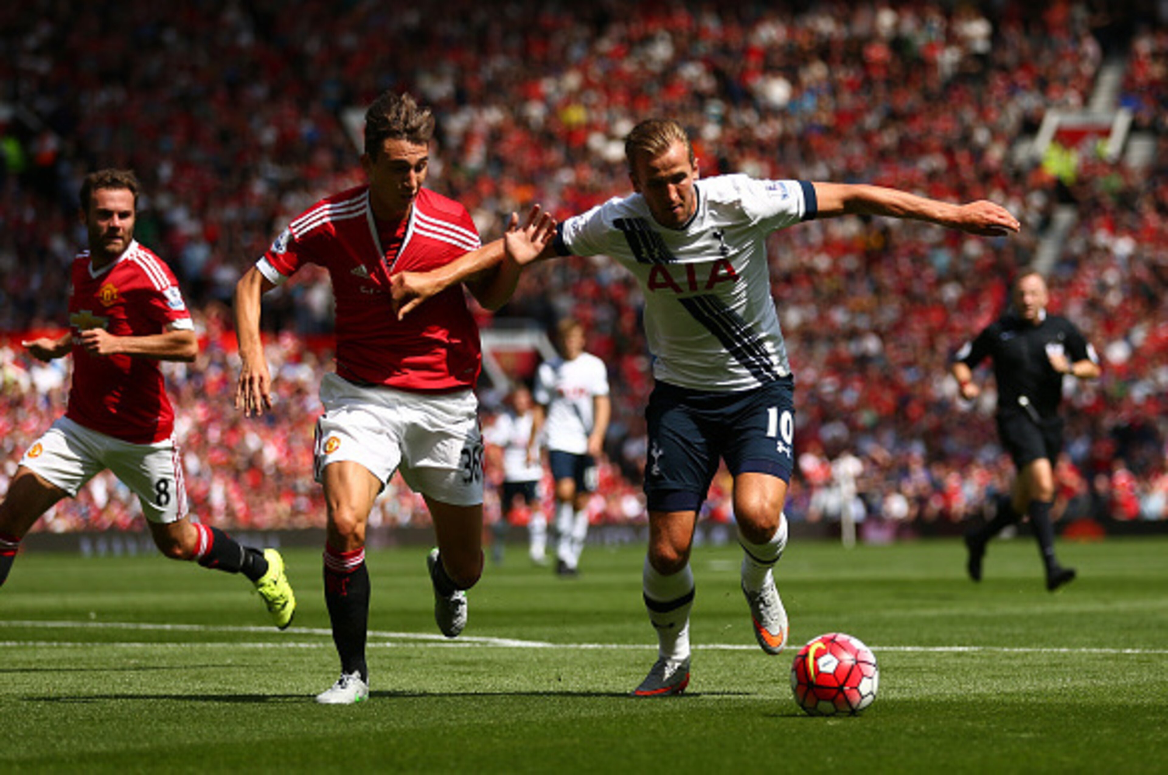 MANCHESTER, ENGLAND - AUGUST 08: Harry Kane of Tottenham Hotspur and Matteo Darmian of Manchester United compete for the ball during the Barclays Premier League match between Manchester United and Tottenham Hotspur at Old Trafford on August 8, 2015 in Ma MANCHESTER, ENGLAND - AUGUST 08: Harry Kane of Tottenham Hotspur and Matteo Darmian of Manchester United compete for the ball during the Barclays Premier League match between Manchester United and Tottenham Hotspur at Old Trafford on August 8, 2015 in Ma