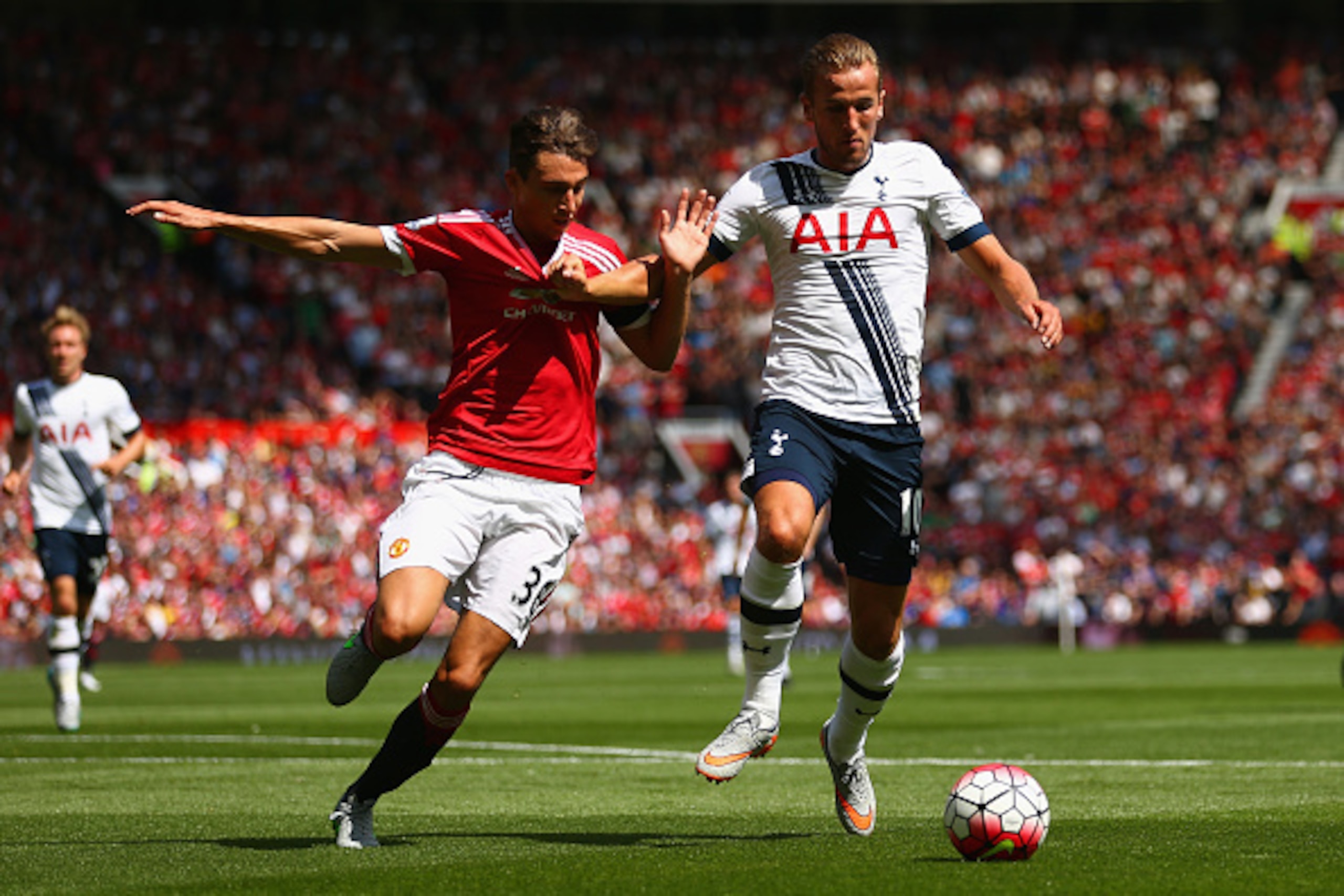 MANCHESTER, ENGLAND - AUGUST 08:  Harry Kane of Tottenham Hotspur and Matteo Darmian of Manchester United compete for the ball during the Barclays Premier League match between Manchester United and Tottenham Hotspur at Old Trafford on August 8, 2015 in Ma