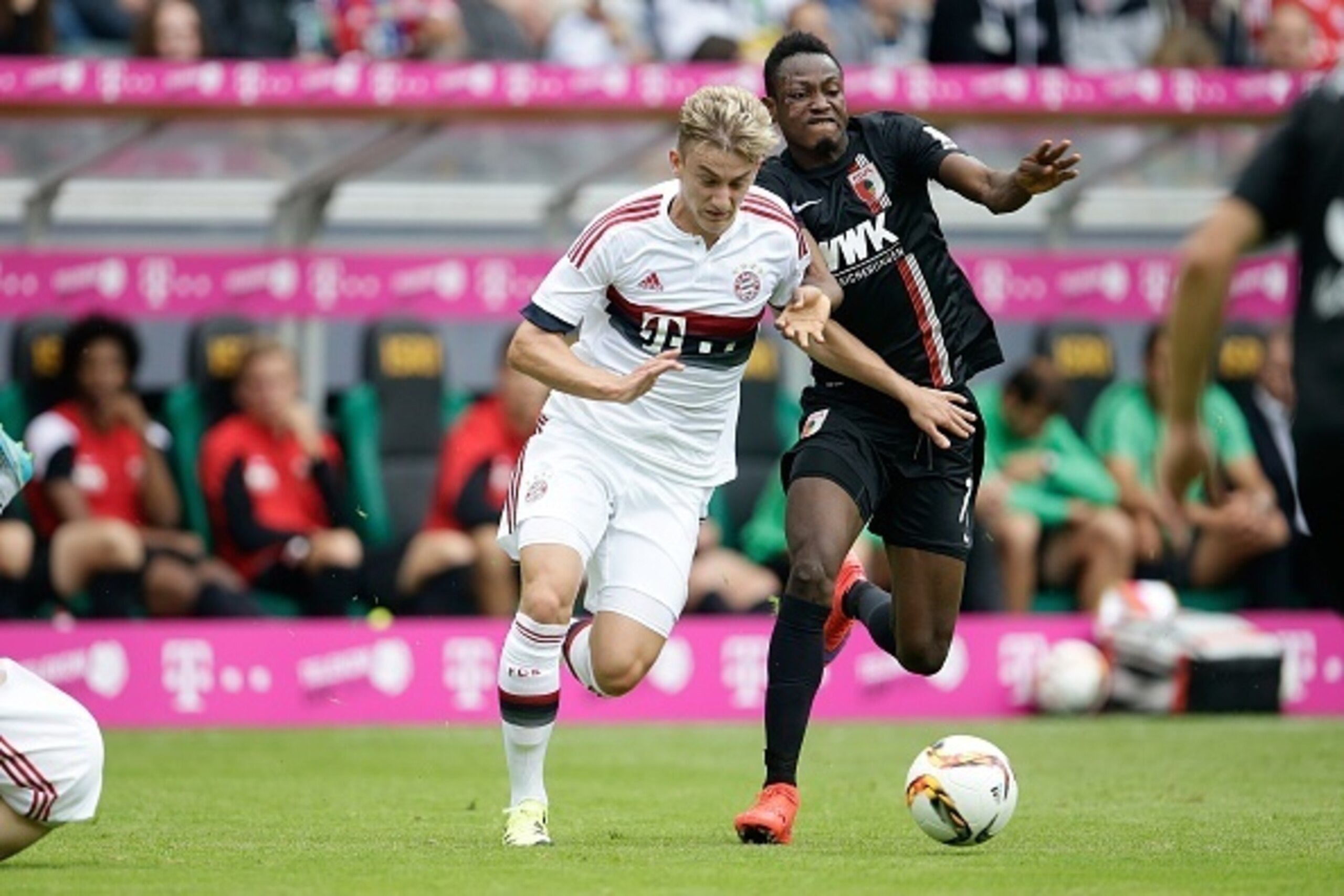 (L-R) Sinan Kurt of FC Bayern Munchen, Abdul Rahman Baba of FC Augsburg during the Telekom Cup friendly match between Bayern Munich and FC Augsburg on July 12, 2015 at the Borussia Park stadium in Monchengladbach, Germany.(Photo by VI Images via Getty Ima