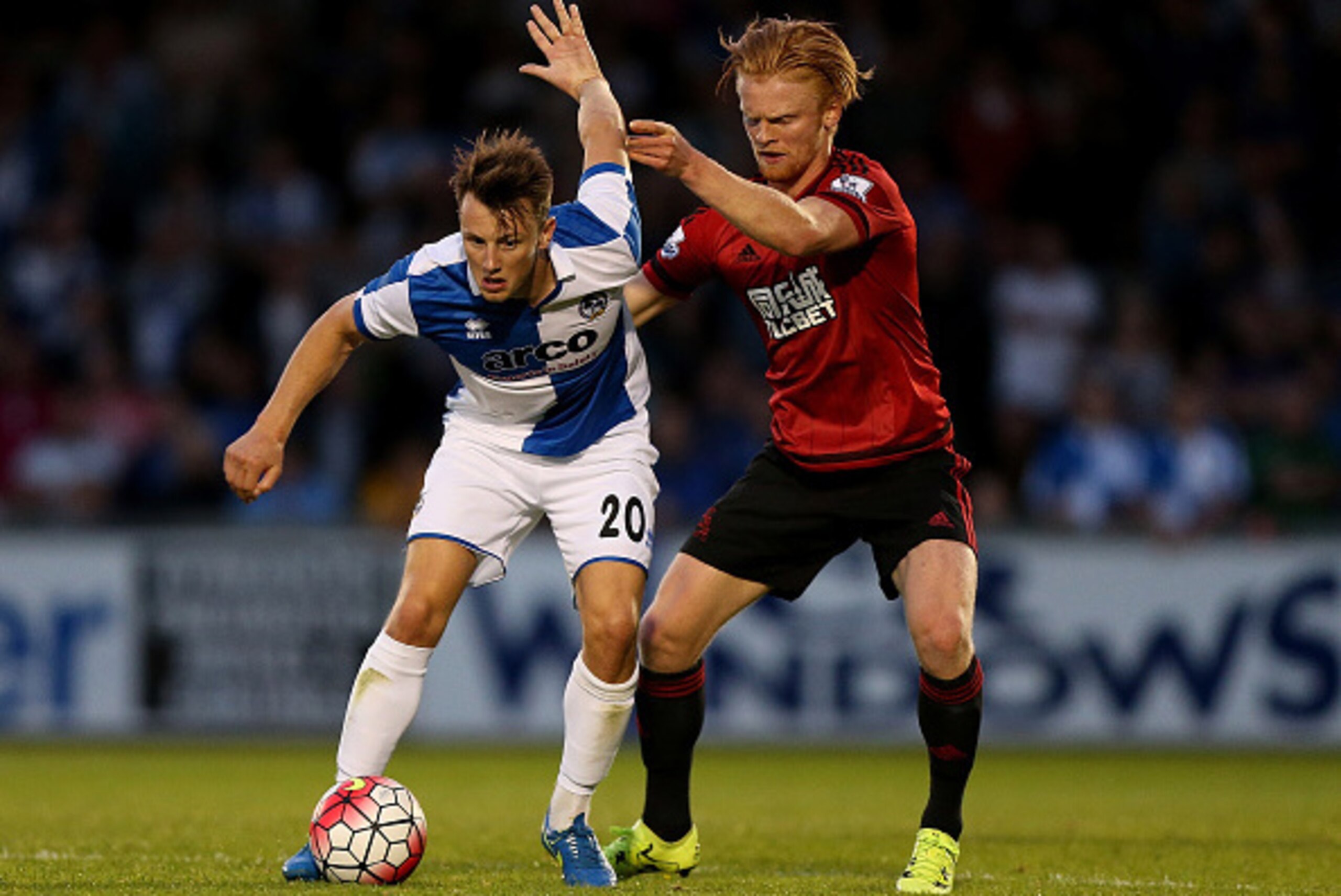 BRISTOL, ENGLAND - JULY 31: Ollie Clarke of Bristol Rovers holds off pressure from Liam O'Niel of West Brom during a pre season friendly match between Bristol Rovers and West Bromwich Albion at Memorial Stadium on July 31, 2015 in Bristol, England. (Pho BRISTOL, ENGLAND - JULY 31: Ollie Clarke of Bristol Rovers holds off pressure from Liam O'Niel of West Brom during a pre season friendly match between Bristol Rovers and West Bromwich Albion at Memorial Stadium on July 31, 2015 in Bristol, England. (Pho