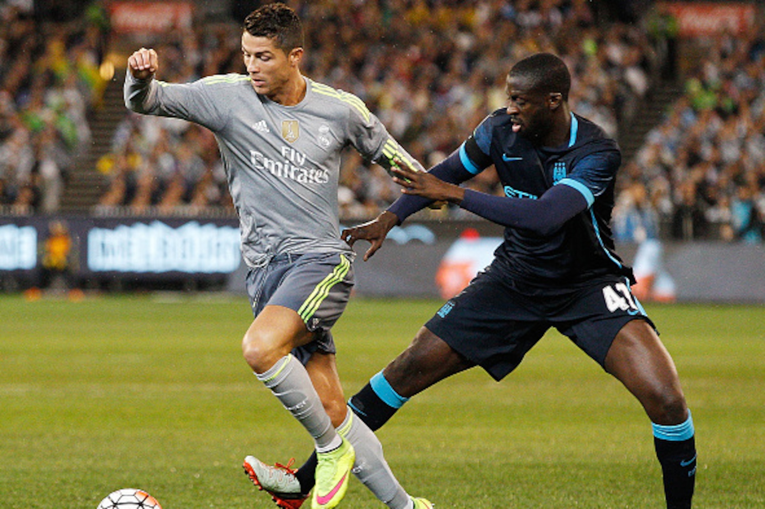 MELBOURNE, AUSTRALIA - JULY 24: Yaya Toure of Manchester City tackles Cristiano Ronaldo of Real Madrid during the International Champions Cup match between Real Madrid and Manchester City at Melbourne Cricket Ground on July 24, 2015 in Melbourne, Australi MELBOURNE, AUSTRALIA - JULY 24: Yaya Toure of Manchester City tackles Cristiano Ronaldo of Real Madrid during the International Champions Cup match between Real Madrid and Manchester City at Melbourne Cricket Ground on July 24, 2015 in Melbourne, Australi