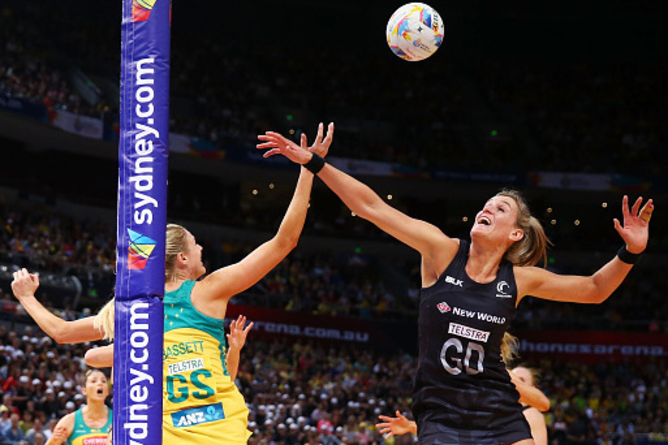 SYDNEY, AUSTRALIA - AUGUST 09:  Leana de Bruin of New Zealand competes with Caitlin Bassett of the Diamonds during the 2015 Netball World Cup match between Australia and New Zealand at Allphones Arena on August 9, 2015 in Sydney, Australia.  (Photo by Mat