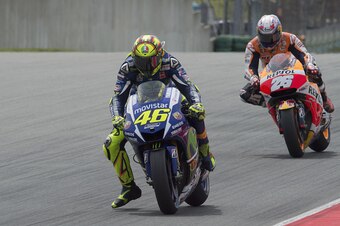 HOHENSTEIN-ERNSTTHAL, GERMANY - JULY 12:  Valentino Rossi of Italy and Movistar Yamaha MotoGP leads Dani Pedrosa of Spain and Repsol Honda Team during the MotoGP race during the MotoGp of Germany - Race at Sachsenring Circuit on July 12, 2015 in Hohenstei