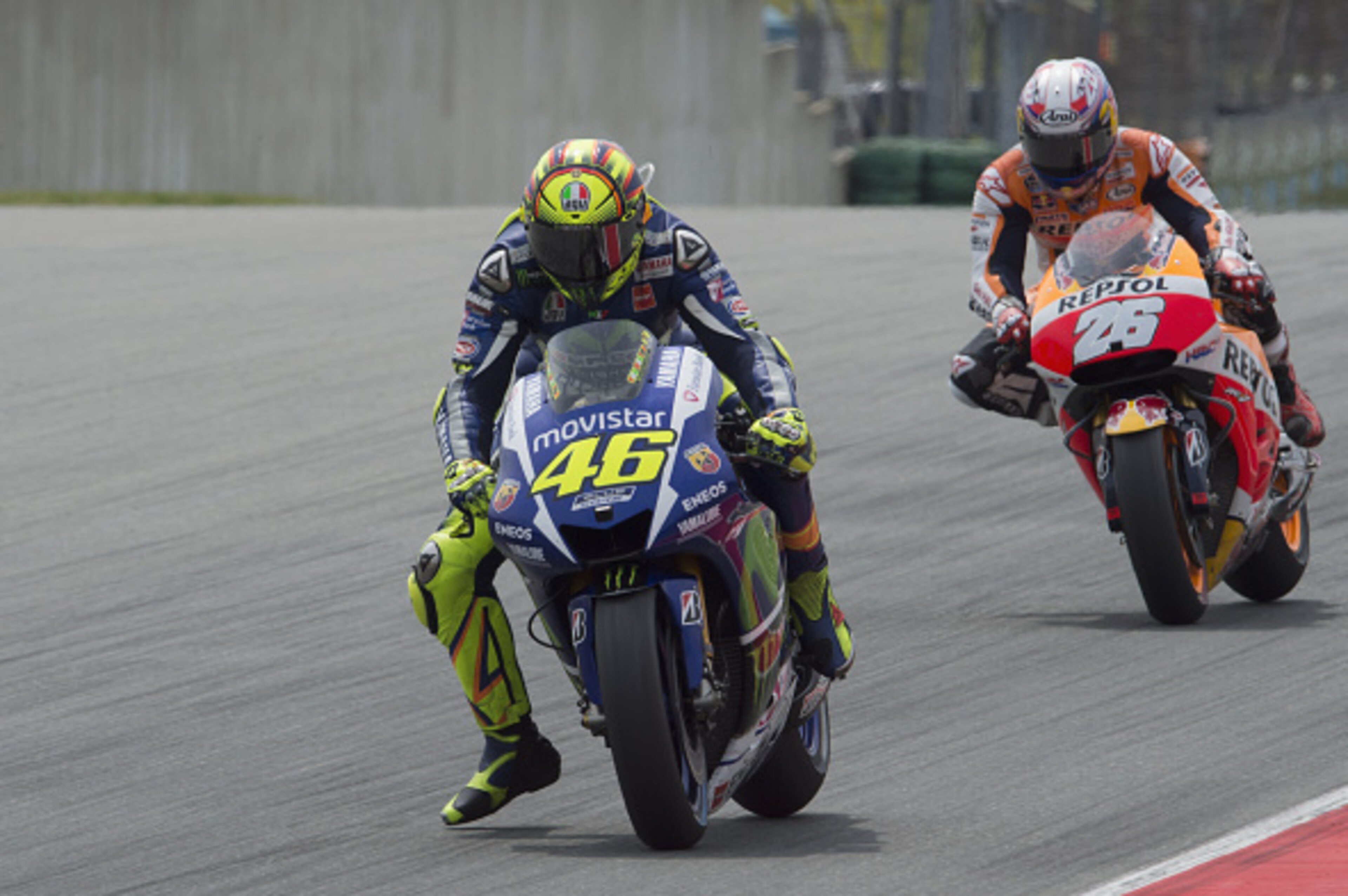 HOHENSTEIN-ERNSTTHAL, GERMANY - JULY 12:  Valentino Rossi of Italy and Movistar Yamaha MotoGP leads Dani Pedrosa of Spain and Repsol Honda Team during the MotoGP race during the MotoGp of Germany - Race at Sachsenring Circuit on July 12, 2015 in Hohenstei