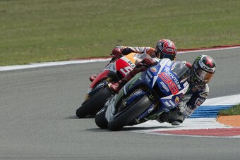 ASSEN, NETHERLANDS - JUNE 26:  Jorge Lorenzo of Spain and Movistar Yamaha MotoGP leads Marc Marquez of Spain and Repsol Honda Team during the MotoGP Netherlands - Qualifying at TT Assen Circuit on June 26, 2015 in Assen, Netherlands.  (Photo by Mirco Lazz
